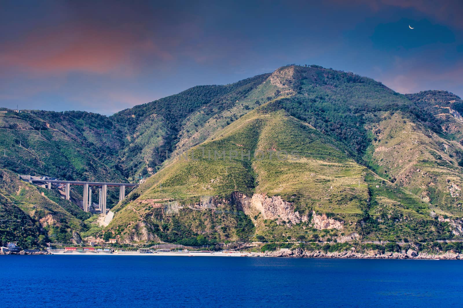 Green Hills and Bridge on Coast of Sicily at Dusk by dbvirago