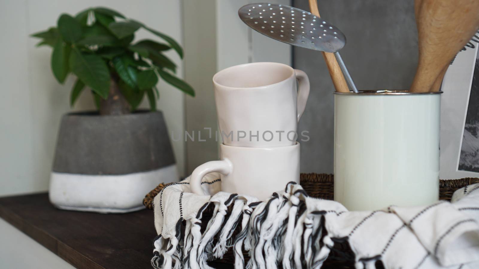 Natural crockery tableware on wooden background. Ceramic dished and cups in neutral tones, scandinavian style.