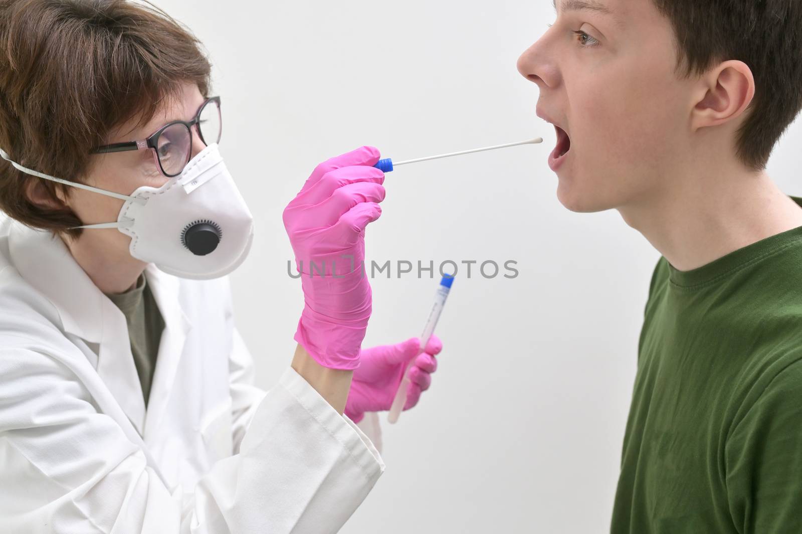 Doctor Collecting with a nose and throat swab by mady70