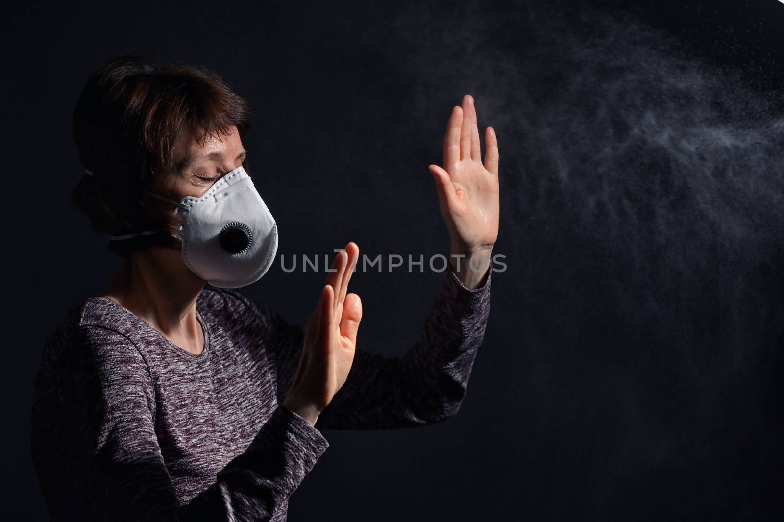 Woman Wearing Medical Protective Virus Mask and pray on dark background