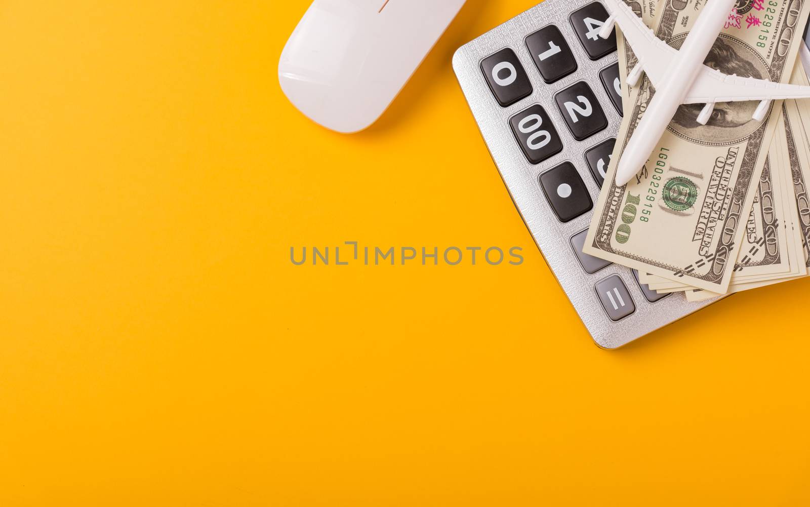 April of the year is Tax Day, Top view flat lay closeup calculator and Dollar money, on yellow background business finance budget concept with copy space for text
