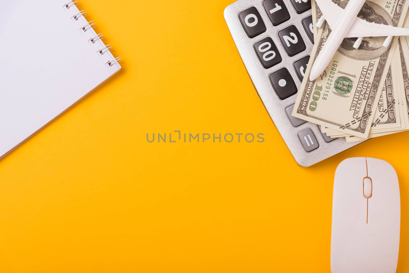 April of the year is Tax Day, Top view flat lay closeup calculator and Dollar money, on yellow background business finance budget concept with copy space for text