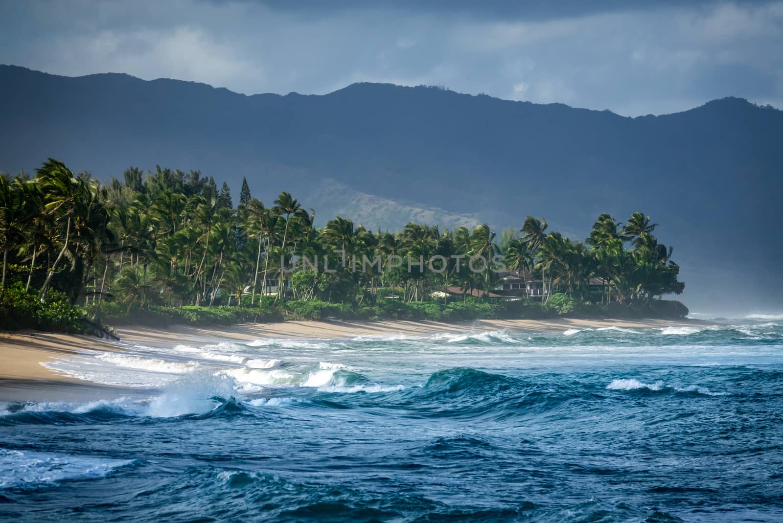 Luxury Beachfront Houses On Hawaii's North Shore On A Stormy Day