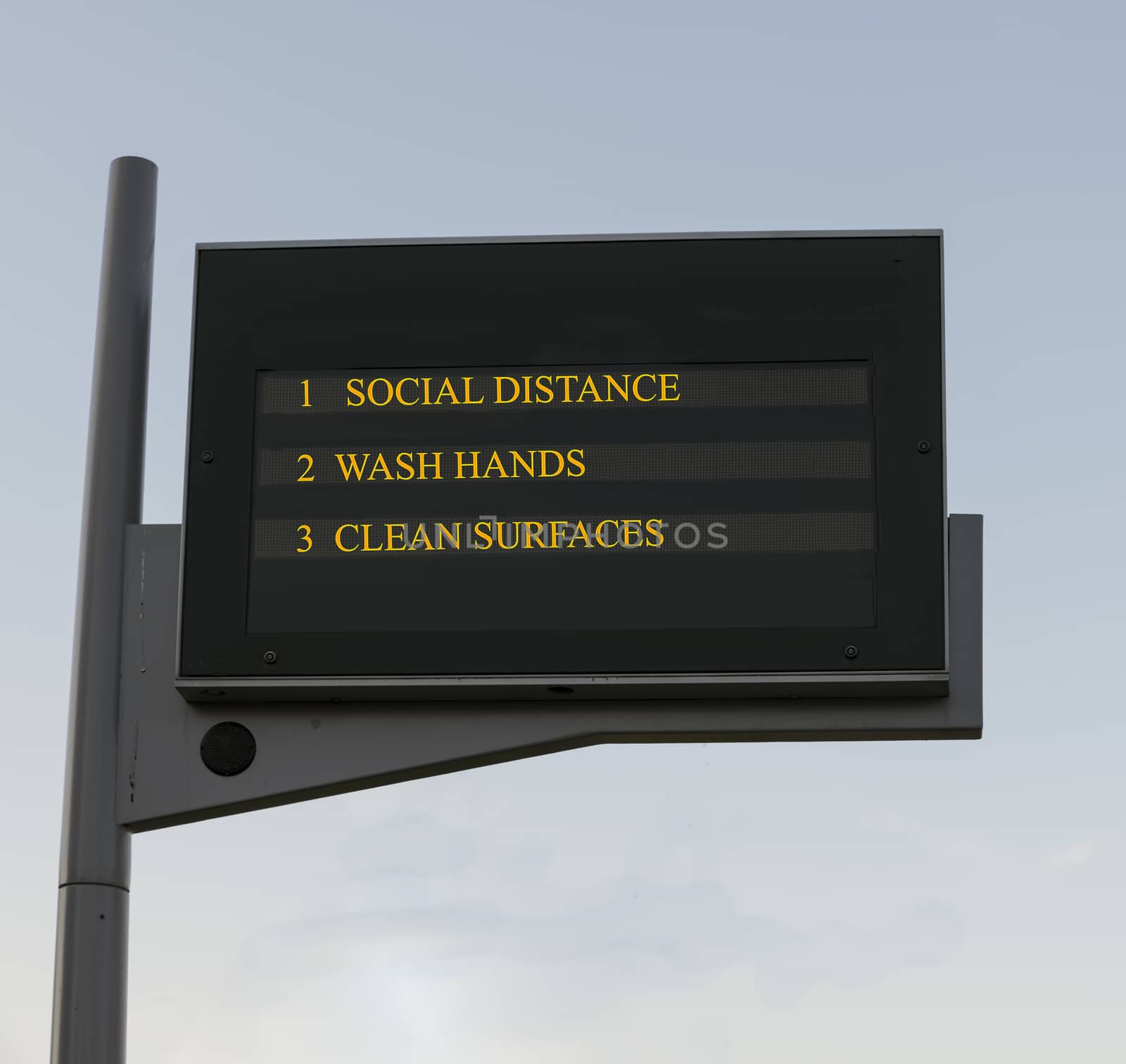 Bus station board billboard with three basic rules to avoid the coronavirus or Covid-19 epidemic of wash hands, maintain social distance and clean surfaces
