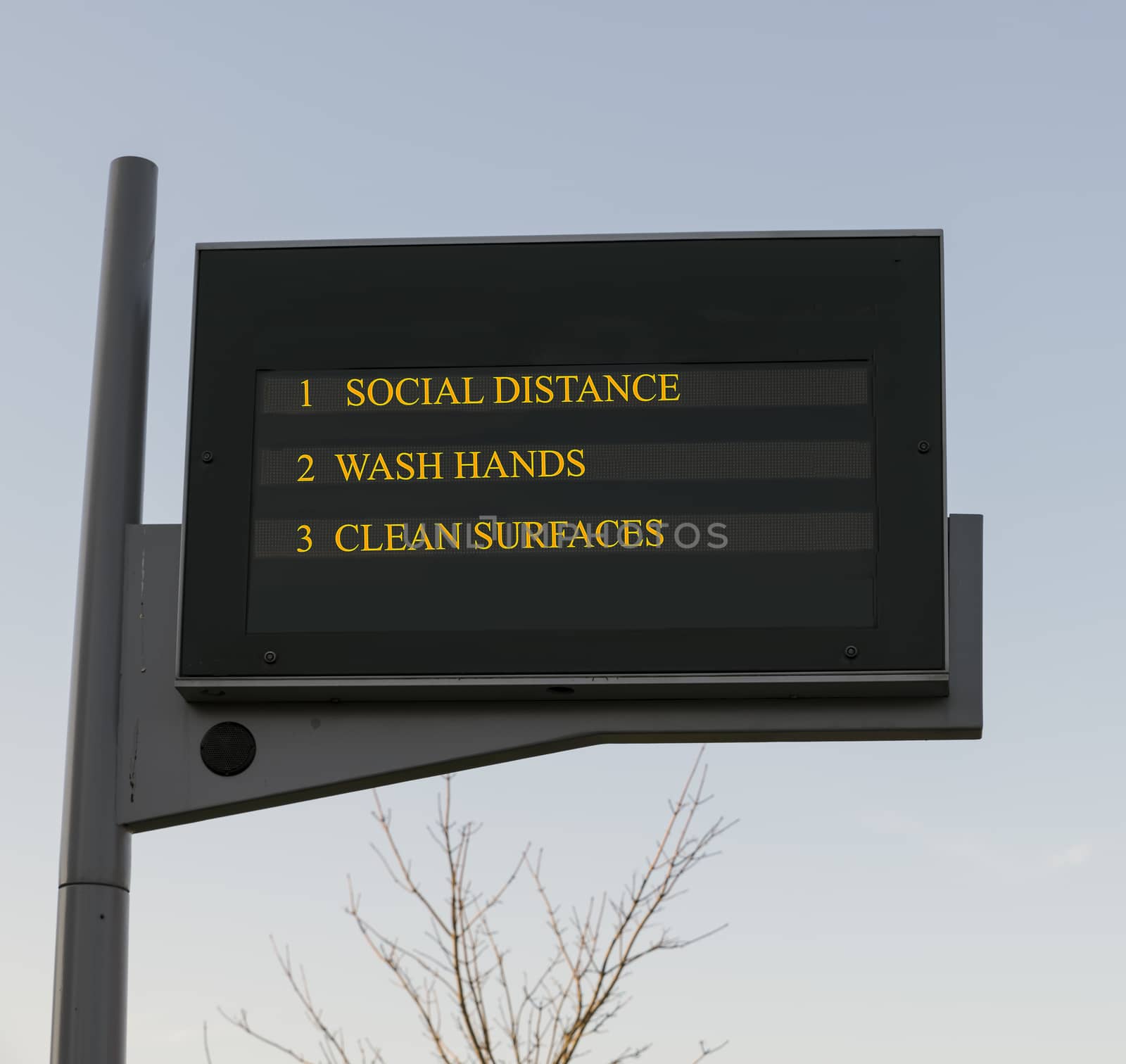 Bus station board billboard with three basic rules to avoid the coronavirus or Covid-19 epidemic of wash hands, maintain social distance and clean surfaces
