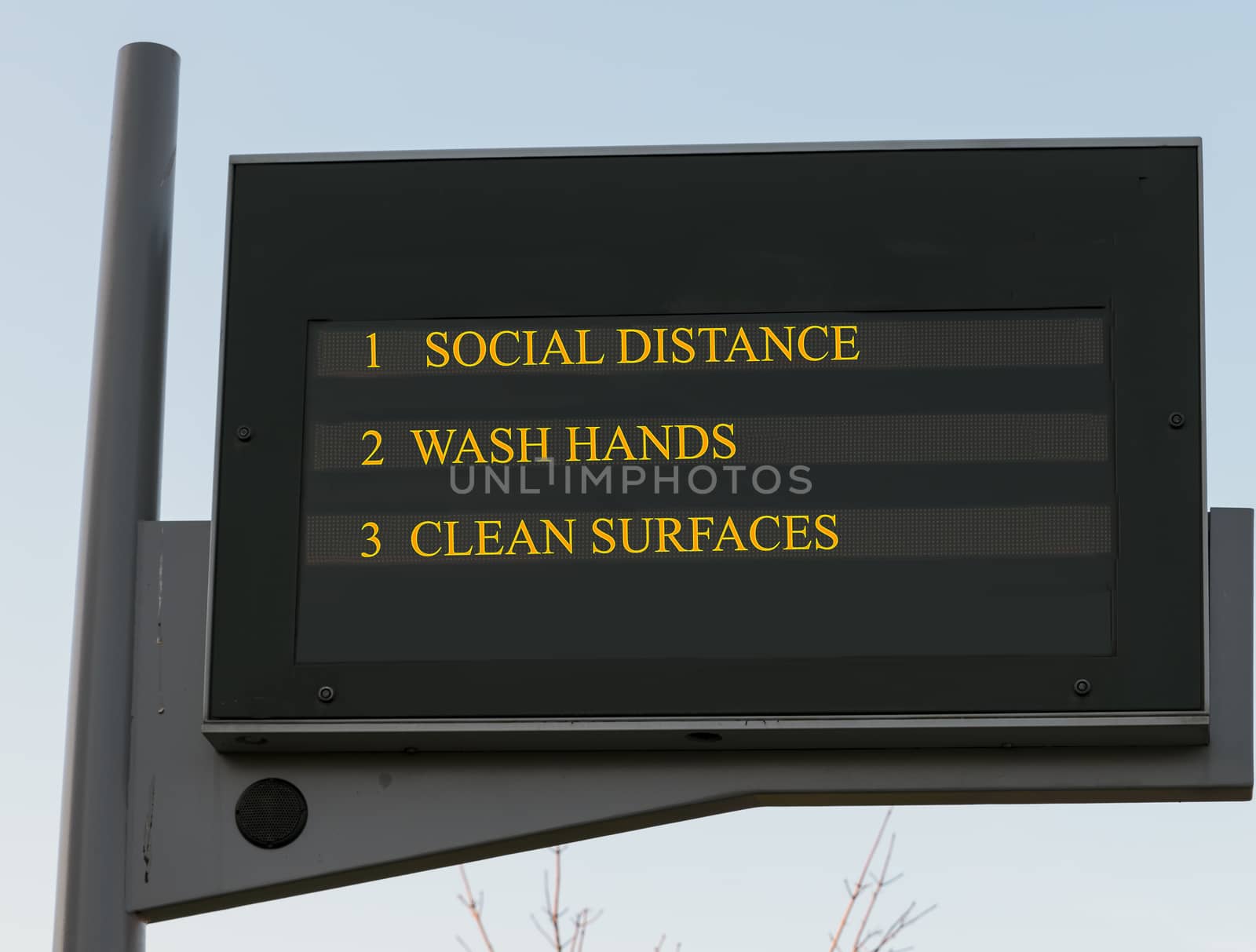 Bus station board billboard with three basic rules to avoid the coronavirus or Covid-19 epidemic of wash hands, maintain social distance and clean surfaces