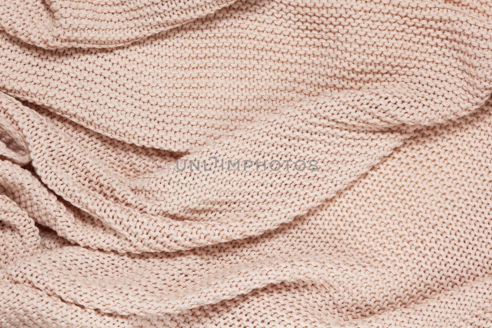Textured surface of knitted cotton wave plaid, top view. Soft dusty pink pastel wool backdrop. Seasonal cosiness flat lay. Scandinavian minimal style. Stay at home, cozy, femininity concept by ALLUNEED