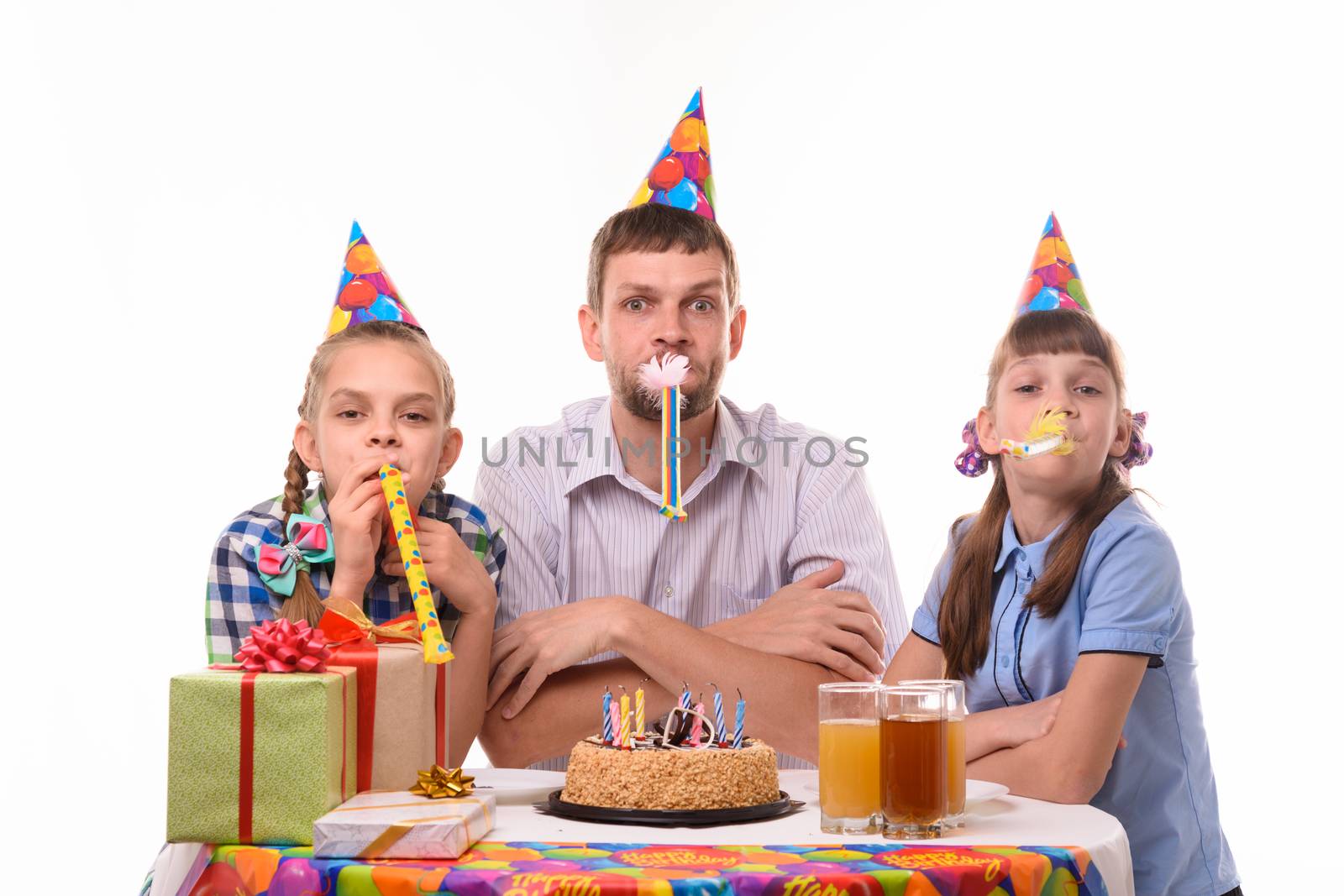 Kids at birthday party have fun blowing whistles