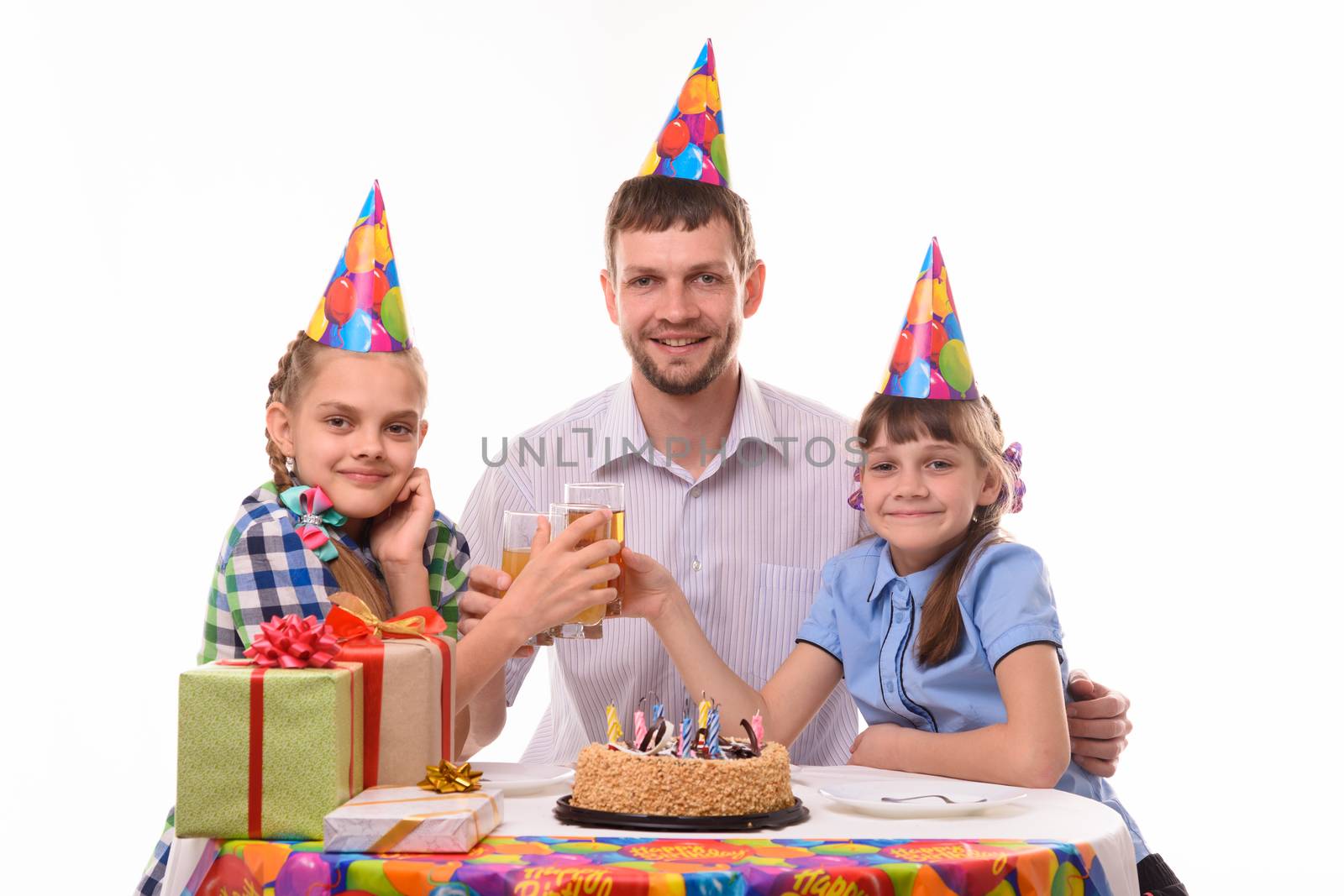 Kids and dad drink juice at a birthday party