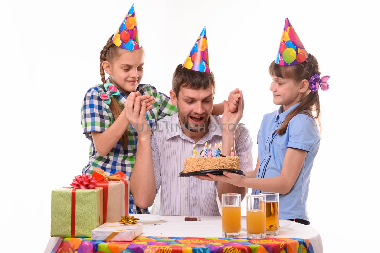 Dad is very happy about the festive sweet surprise prepared by the children