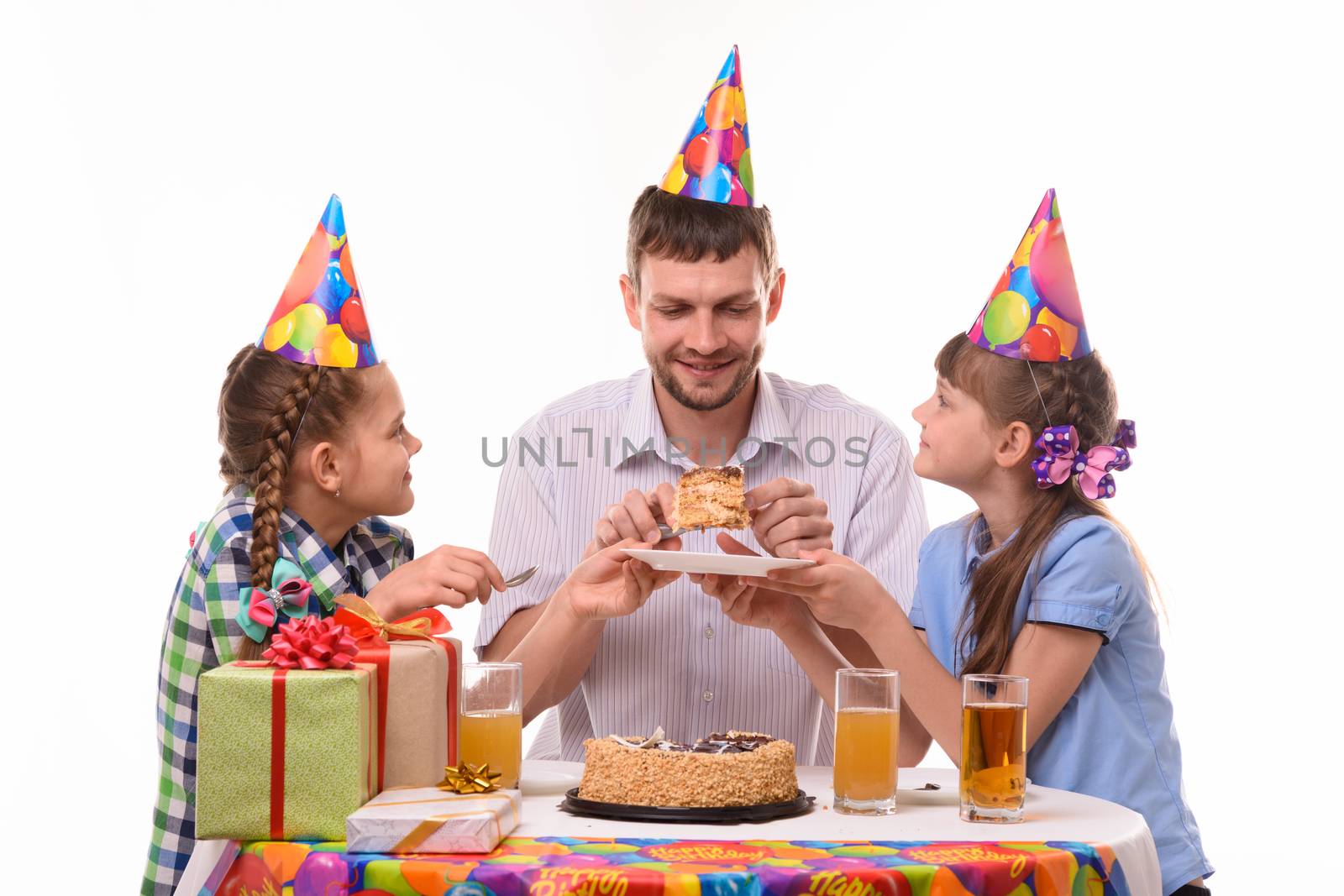Children ask dad for their piece of holiday cake