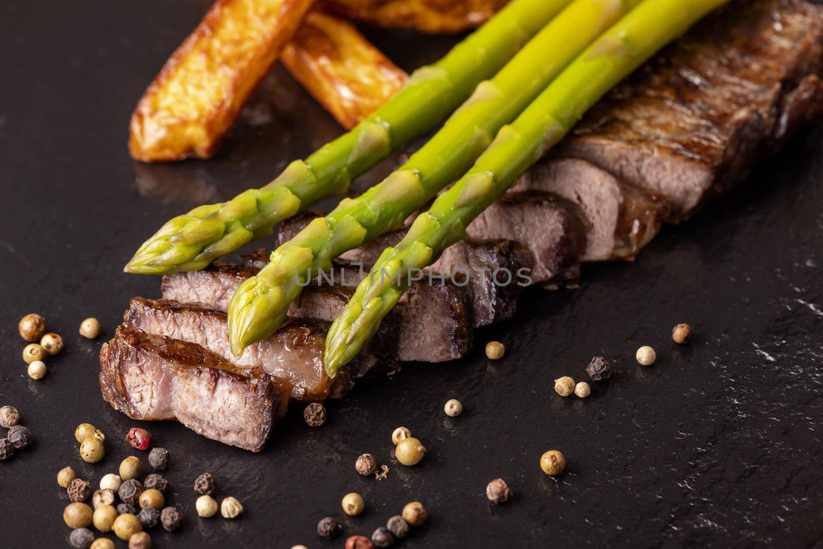 green asparagus on a steak