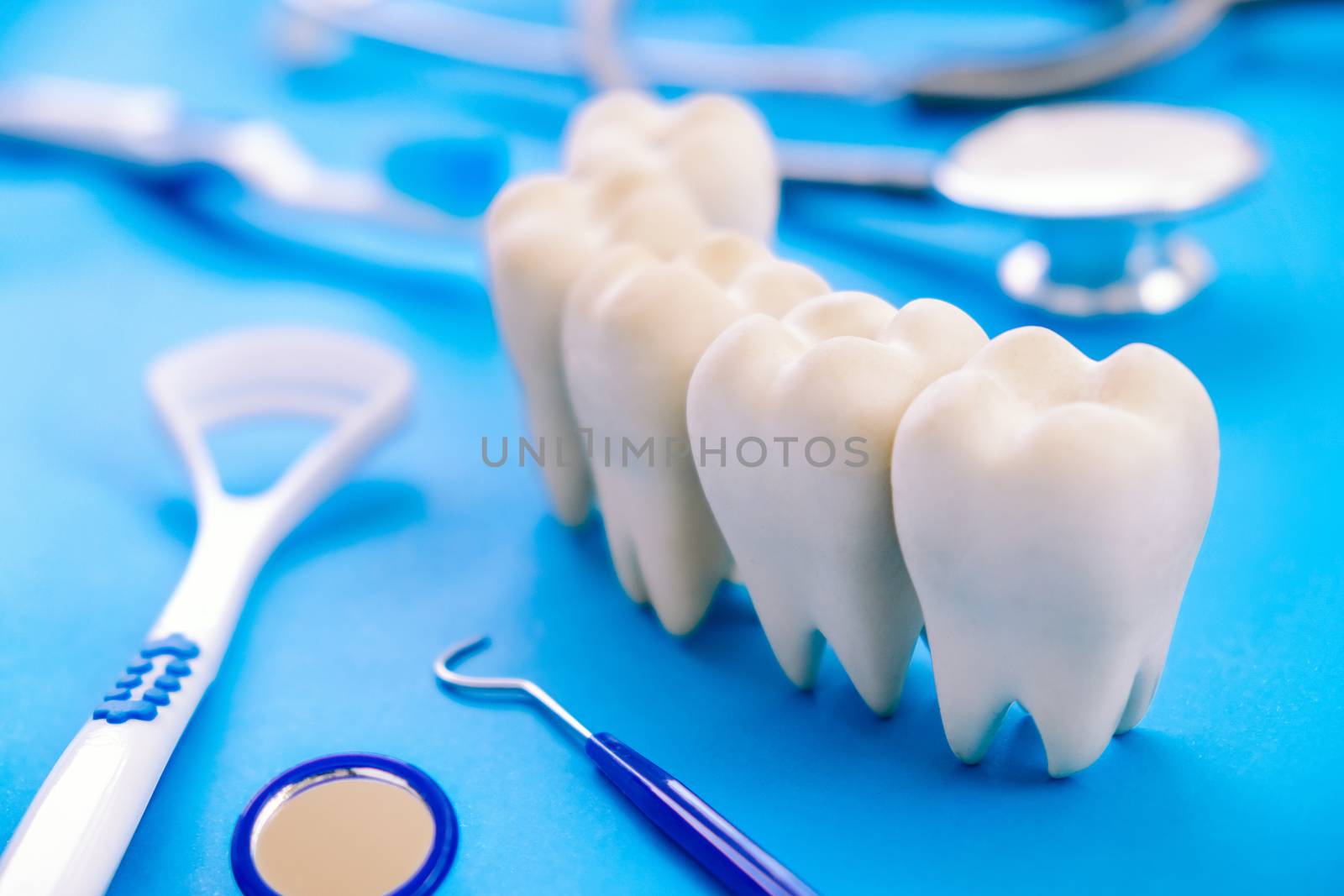 Dental model and dental equipment on blue background, concept image of dental background. dental hygiene background