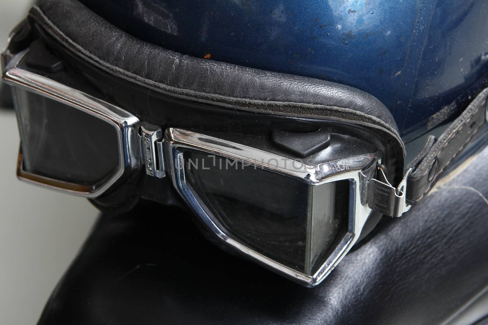 Old biker helmet and goggles. with break pedal