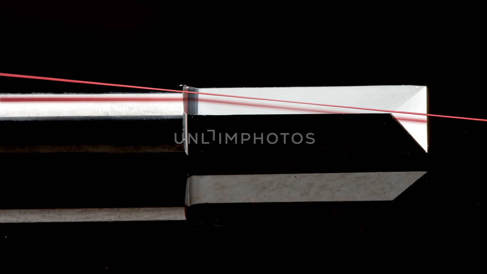 close up of high tech wire cutter. black background with copy space