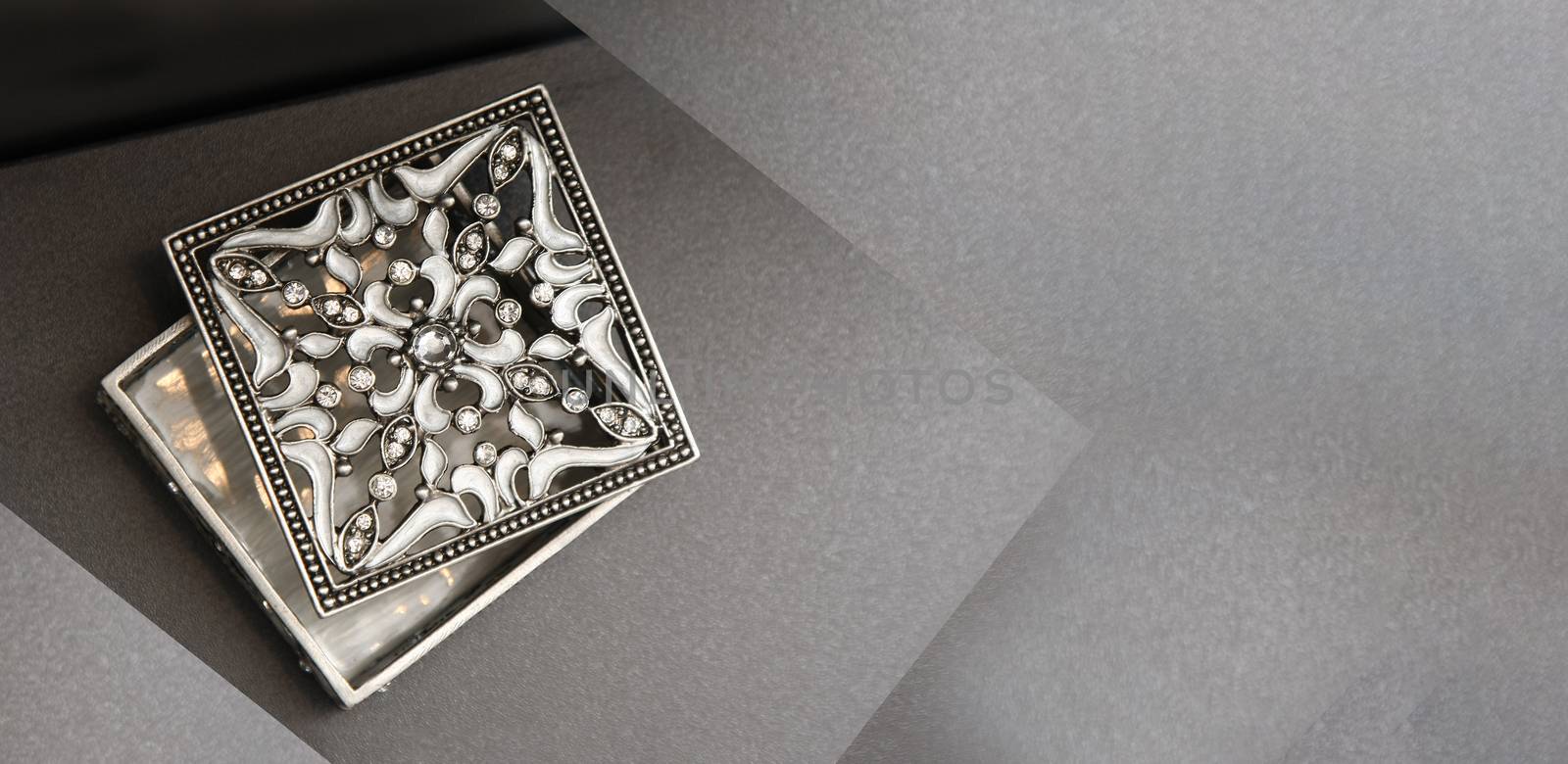 silver jewelery box on grey background by PeterHofstetter