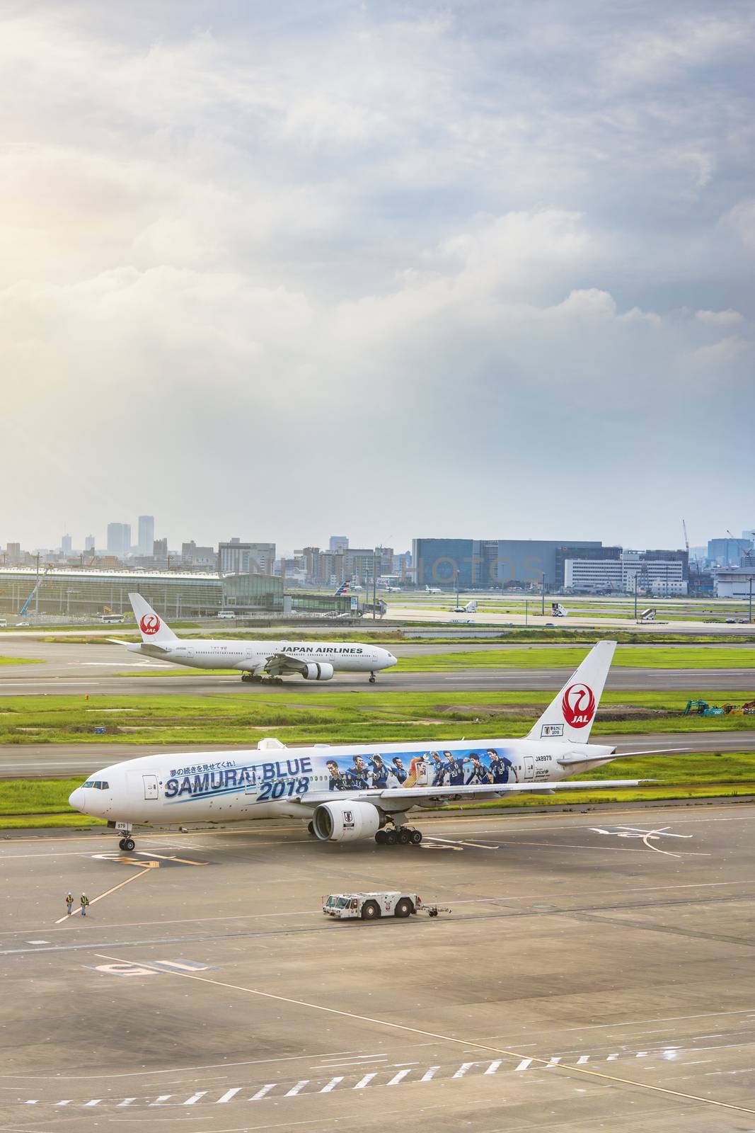 japanese JAL boeing plane decorated with a giant sticker by kuremo