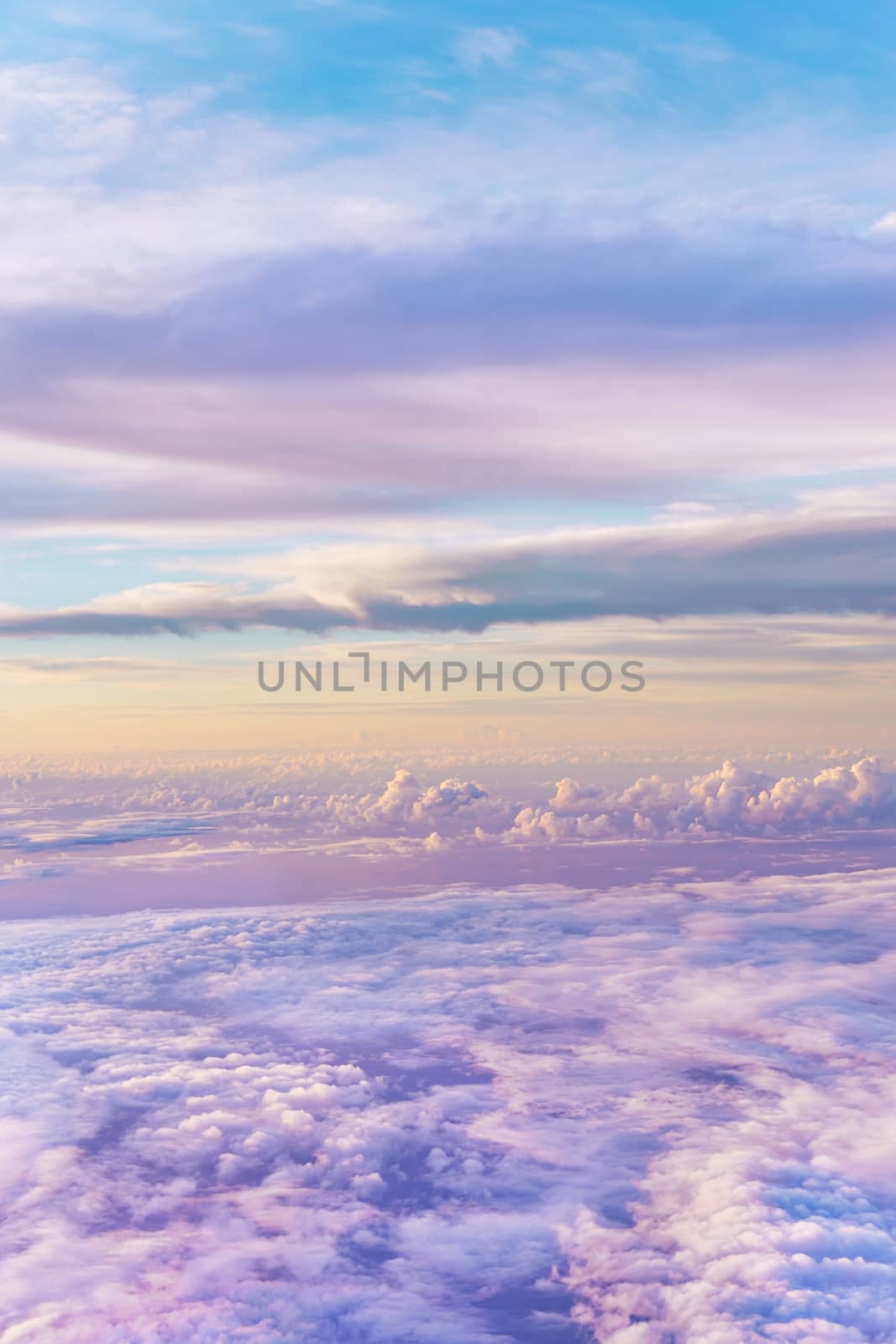 dramatic and spiritual cloudscape with dramatic clouds reflecting the rays of sunset light.