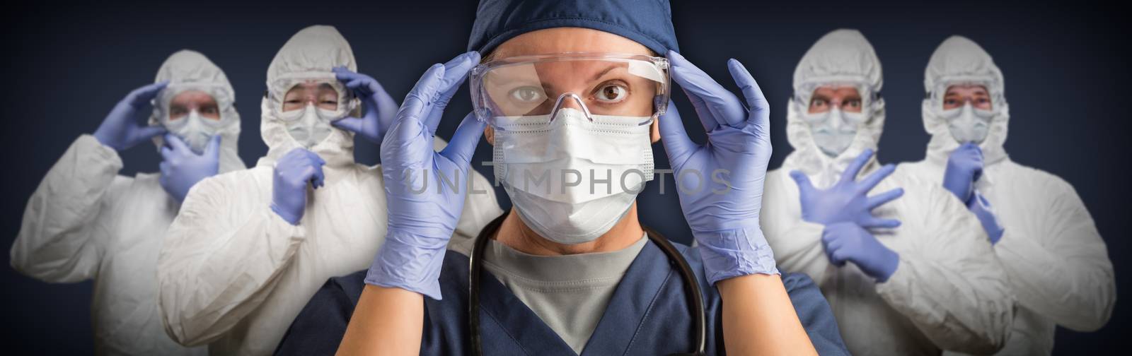 Team of Female and Male Doctors or Nurses Wearing Protective Medical Face Masks and Goggles Banner. by Feverpitched