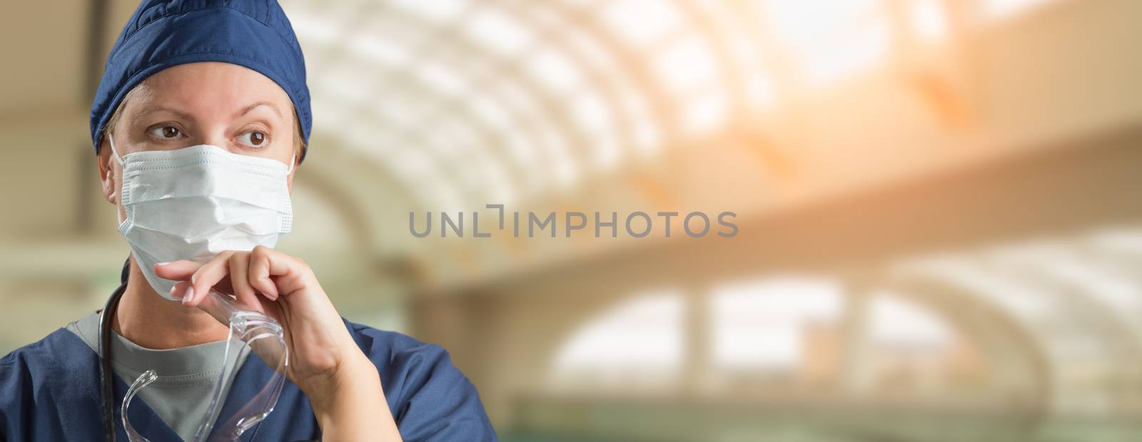 Banner of Female Doctor or Nurse Wearing Protective Face Mask and Surgical Gloves In Hospital. by Feverpitched