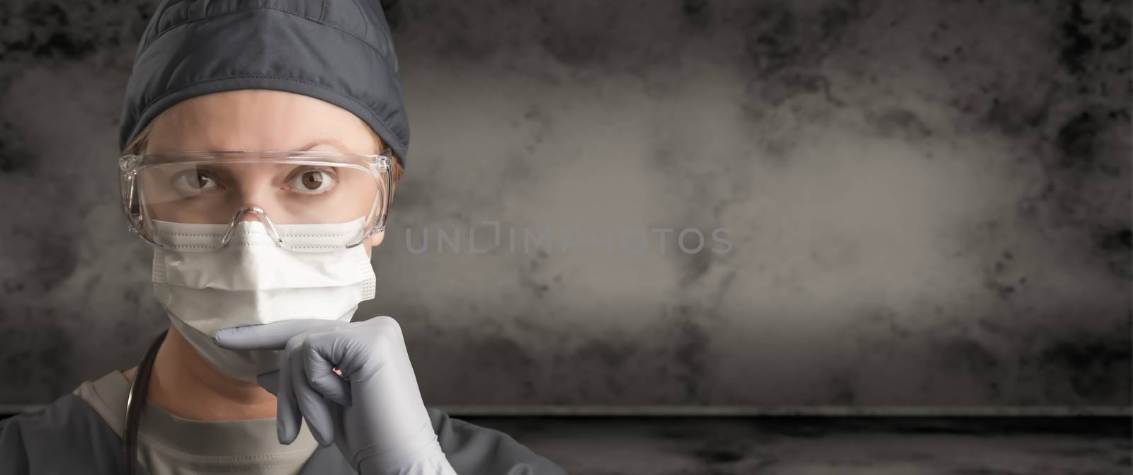 Female Doctor or Nurse Wearing Scrubs, Protective Face Mask and Goggles Banner. by Feverpitched