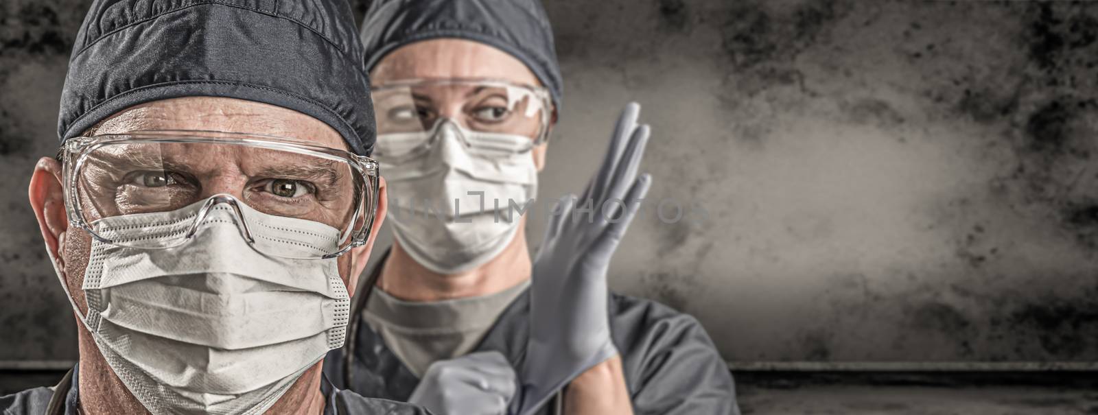 Female and Male Doctors or Nurses Wearing Scrubs and Protective Mask and Goggles Banner. by Feverpitched