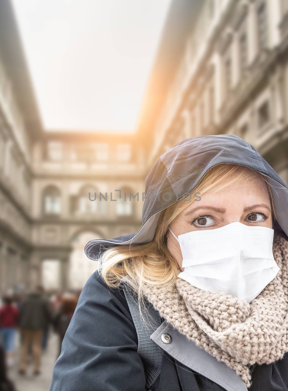 Young Woman Wearing Face Mask Walks Near the Uffizi Gallery In Italy. by Feverpitched