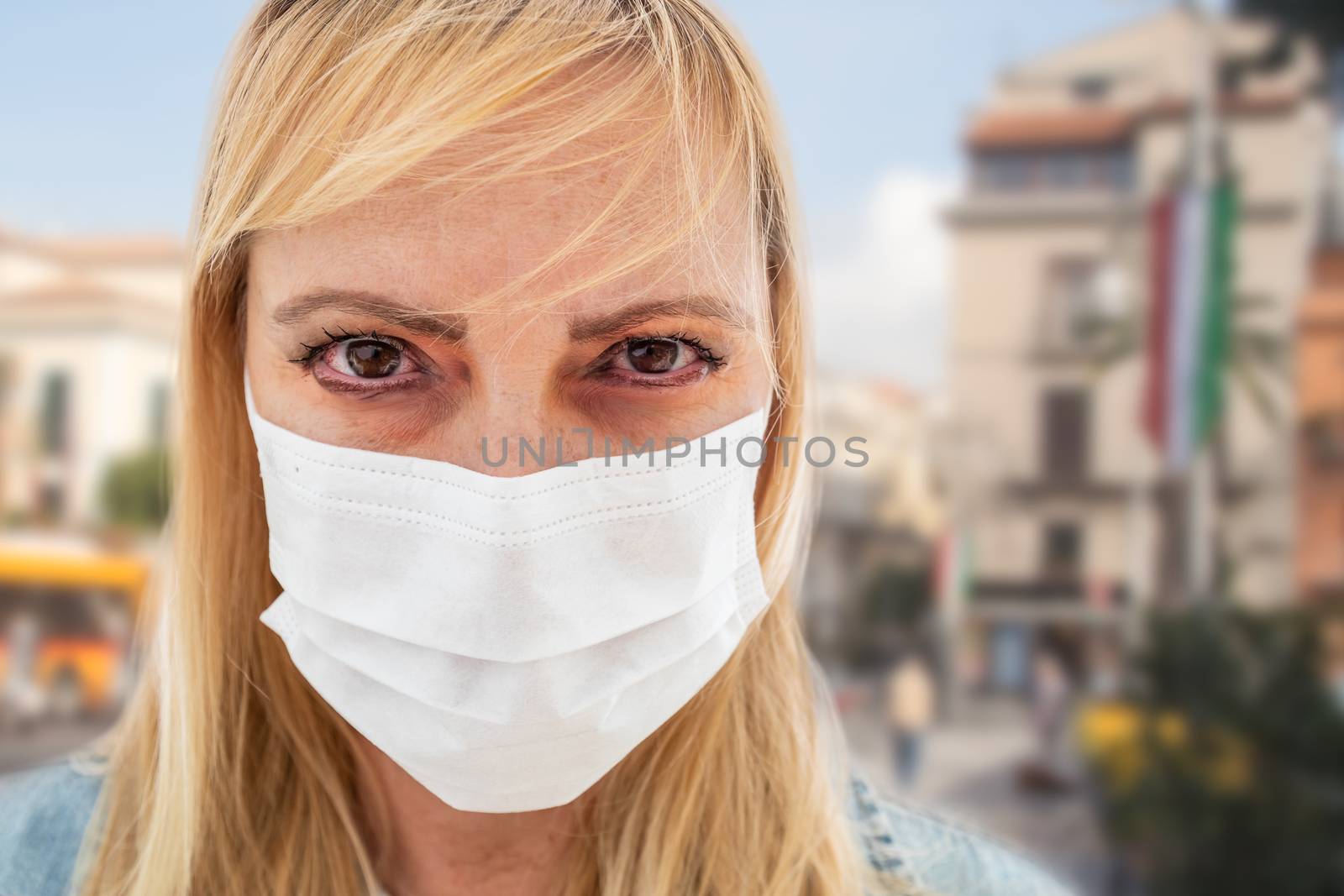 Sick Infected Young Woman Wearing Face Mask Walks on Street In Italy by Feverpitched