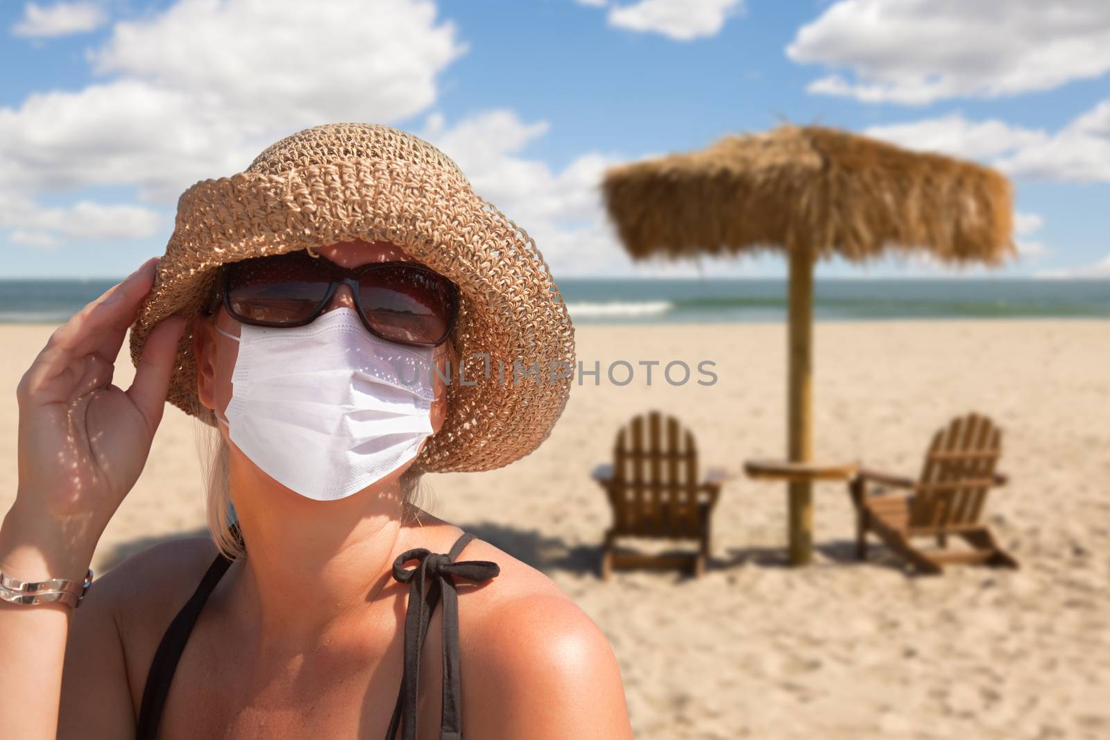 Vacationing Woman Wearing Face Mask on Sandy Beach. by Feverpitched