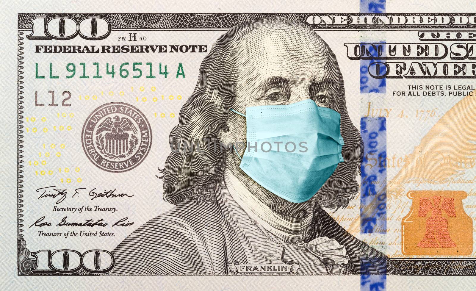 One Hundred Dollar Bill With Medical Face Mask on Benjamin Franklin.