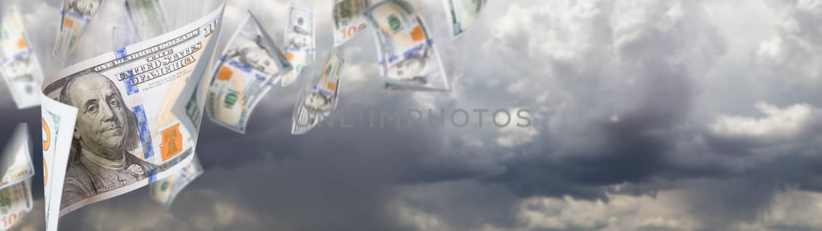 Several 100 Dollar Bills Falling From Stormy Cloudy Sky Banner.
