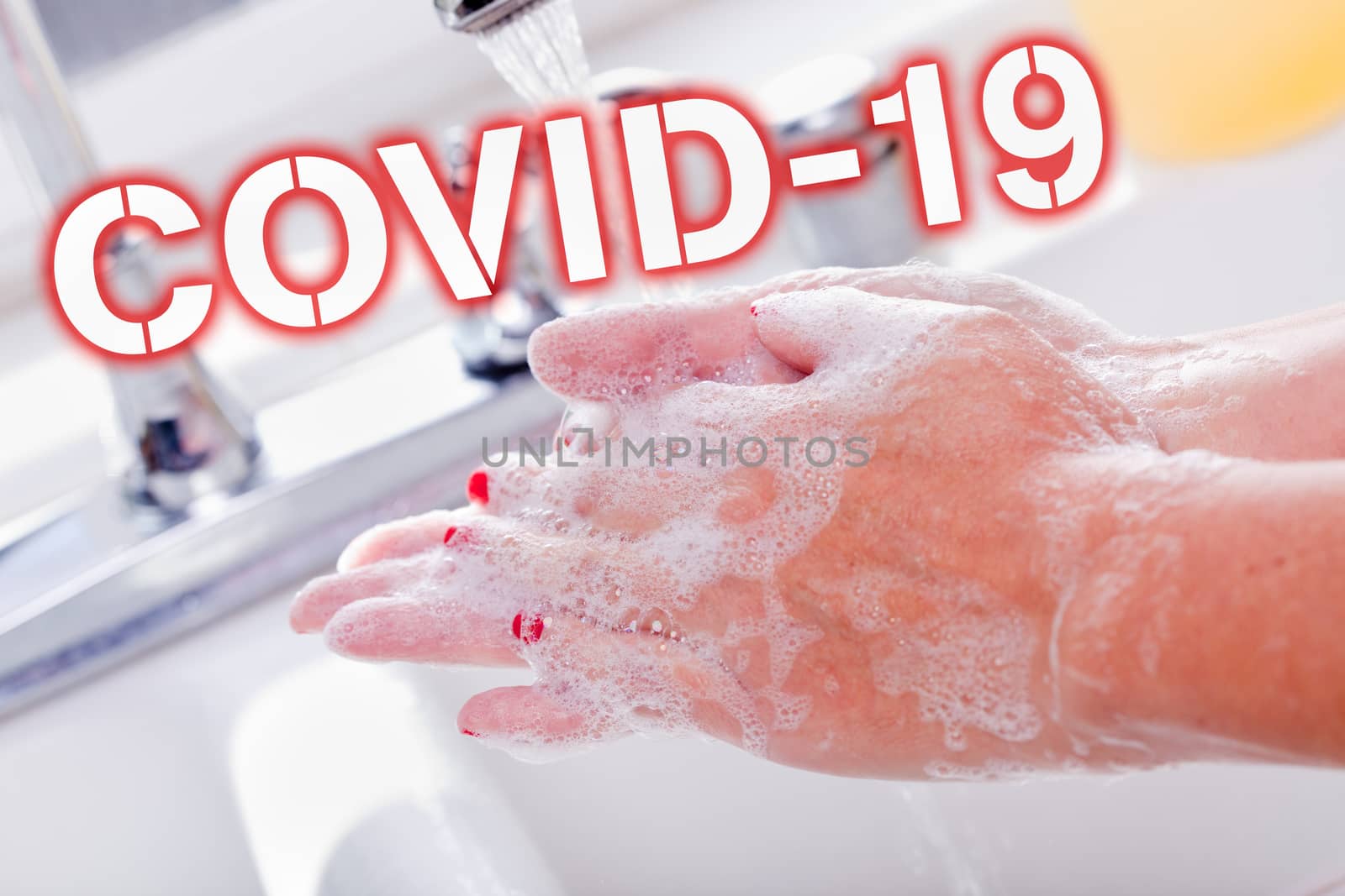 Woman Thoroughly Washing Hands in the Sink Basin With COVID-19 Coronavirus Text.