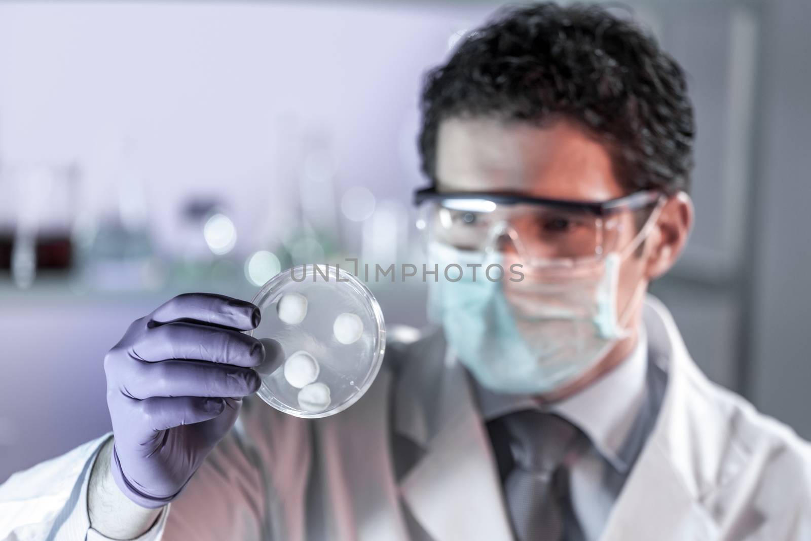 Scientist working in corona virus vaccine development laboratory research facility. by kasto