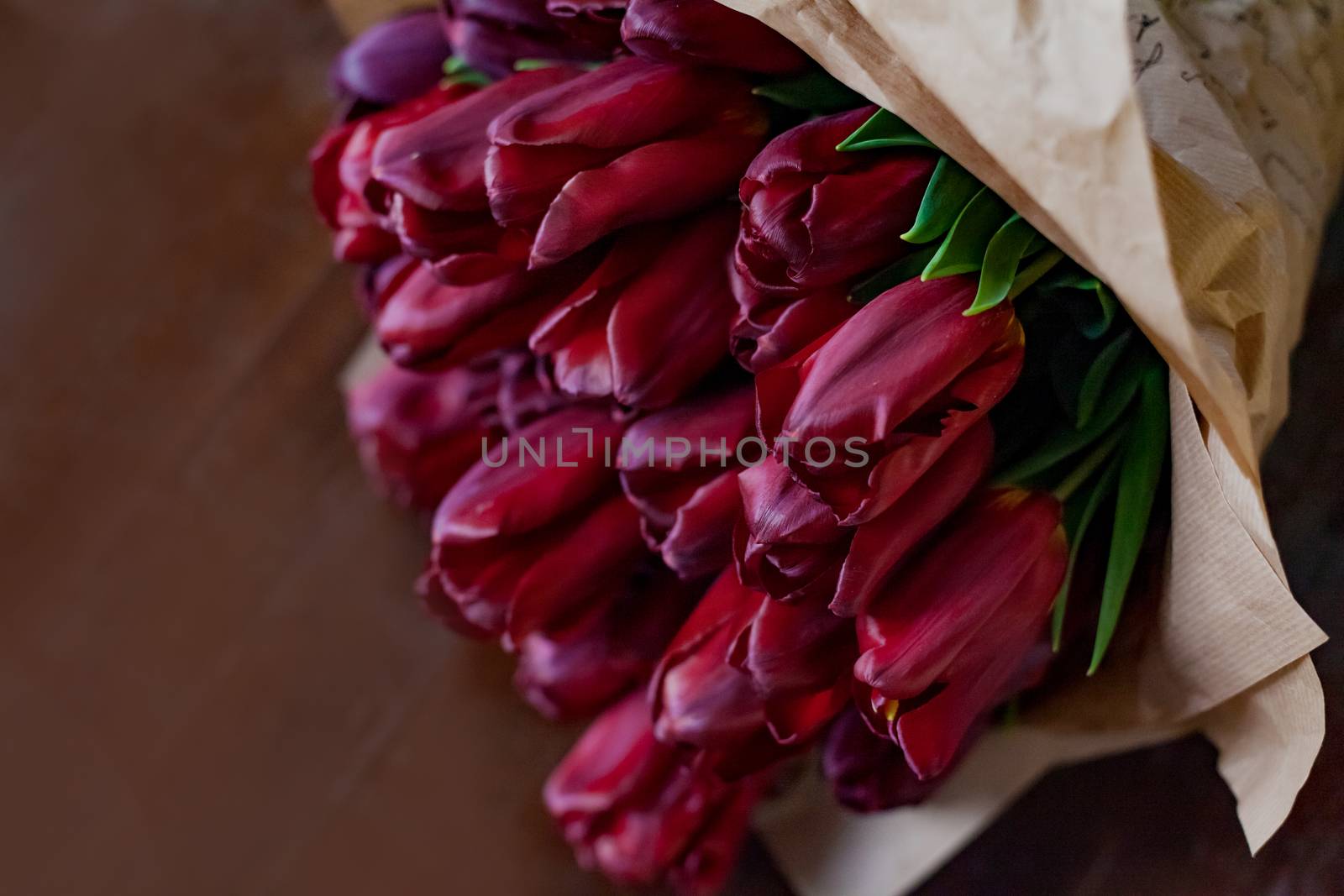 Red tulip bouquet on wooden background by Angel_a