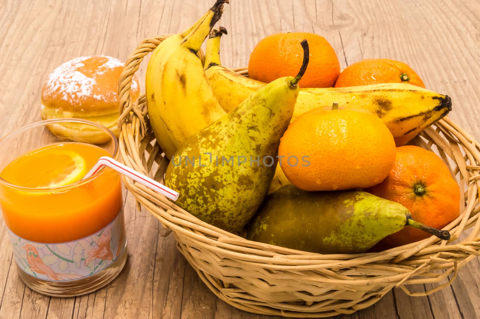 Healthy food. Organic fruits and vegetables with multifruit juice on a wooden background