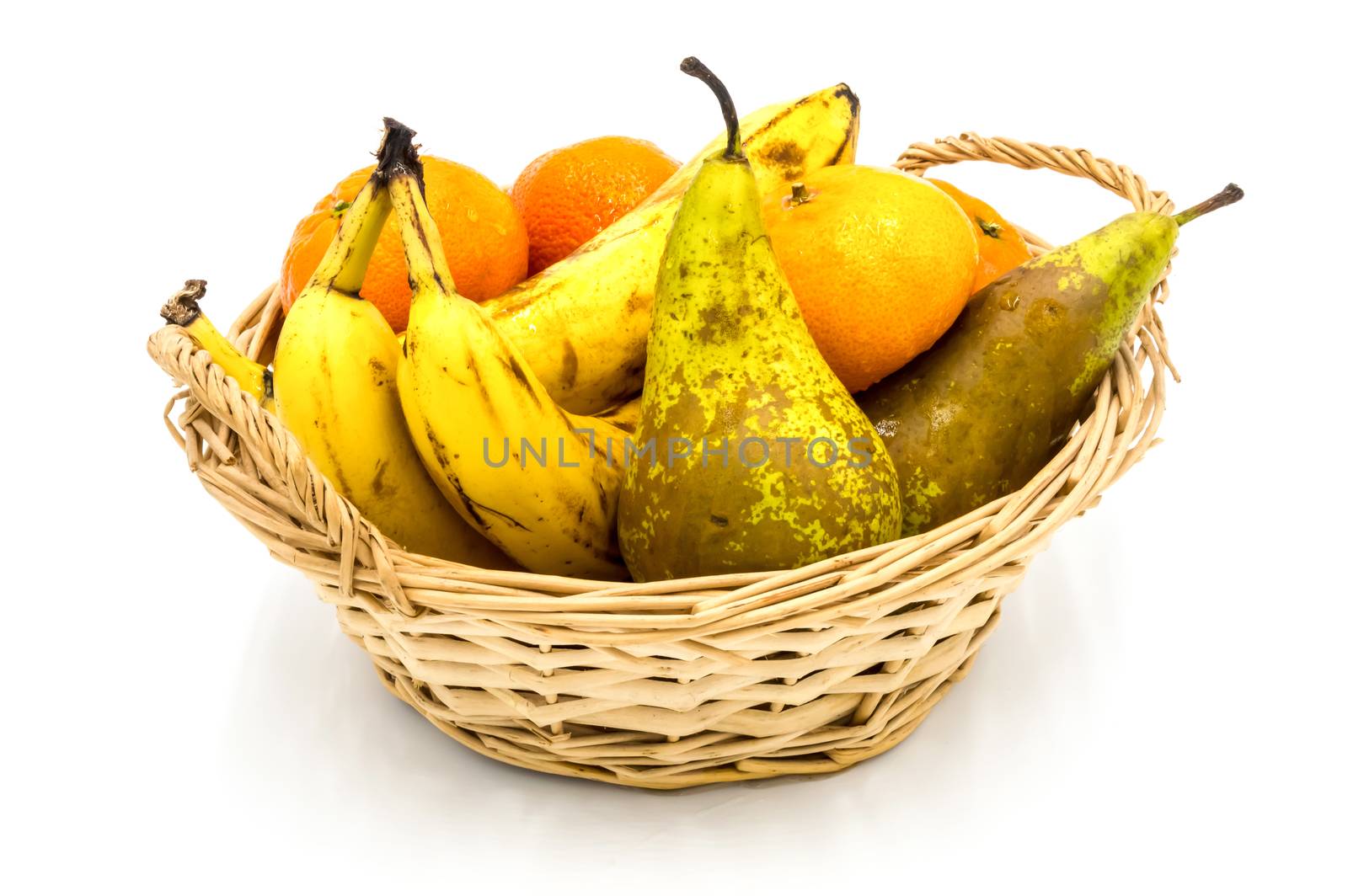 Healthy food. Organic fruits and vegetables, bananas, clementines, pears on a wooden background