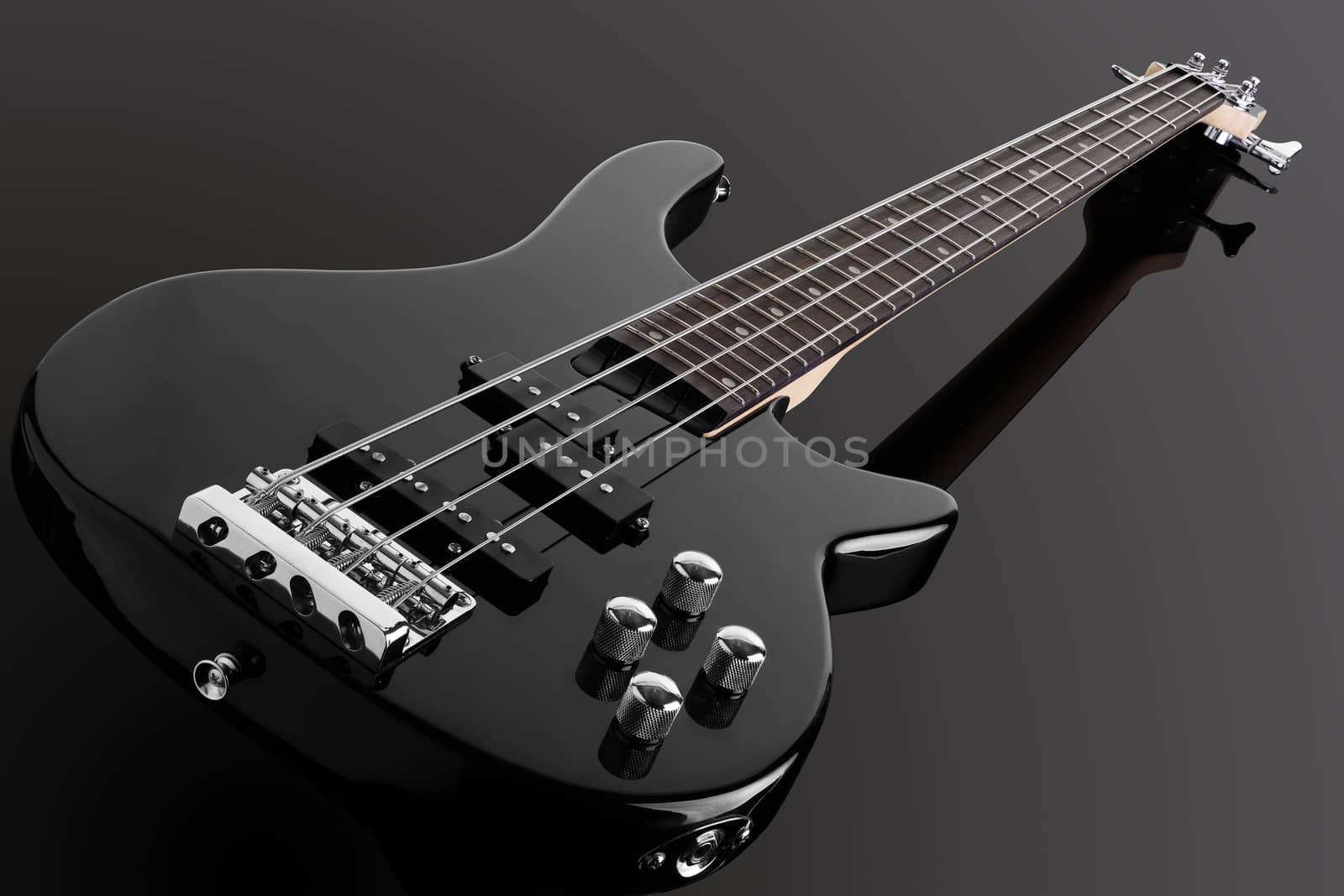 Bass guitar isolated on a black background by VivacityImages