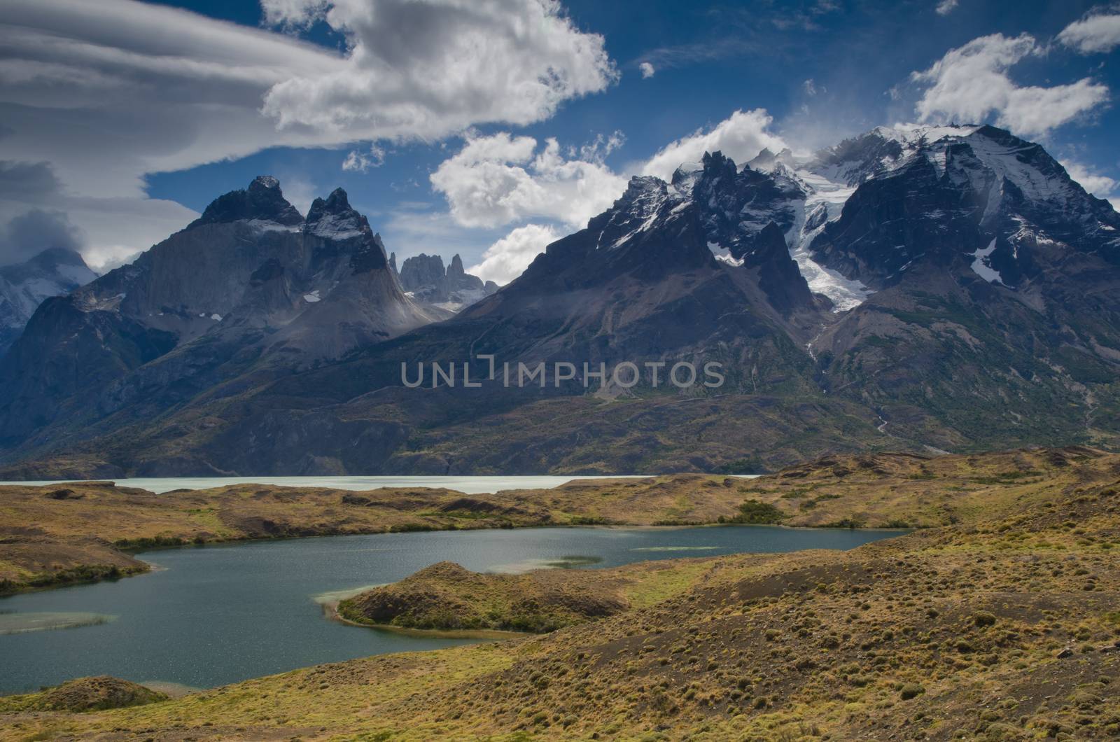 Nordenskjold lake and Cordillera Paine with the Paine Horns in the foreground and the Towers of Paine in the background. Torres del Paine National Park. Magallanes and Chilean Antarctic Region. Chile.