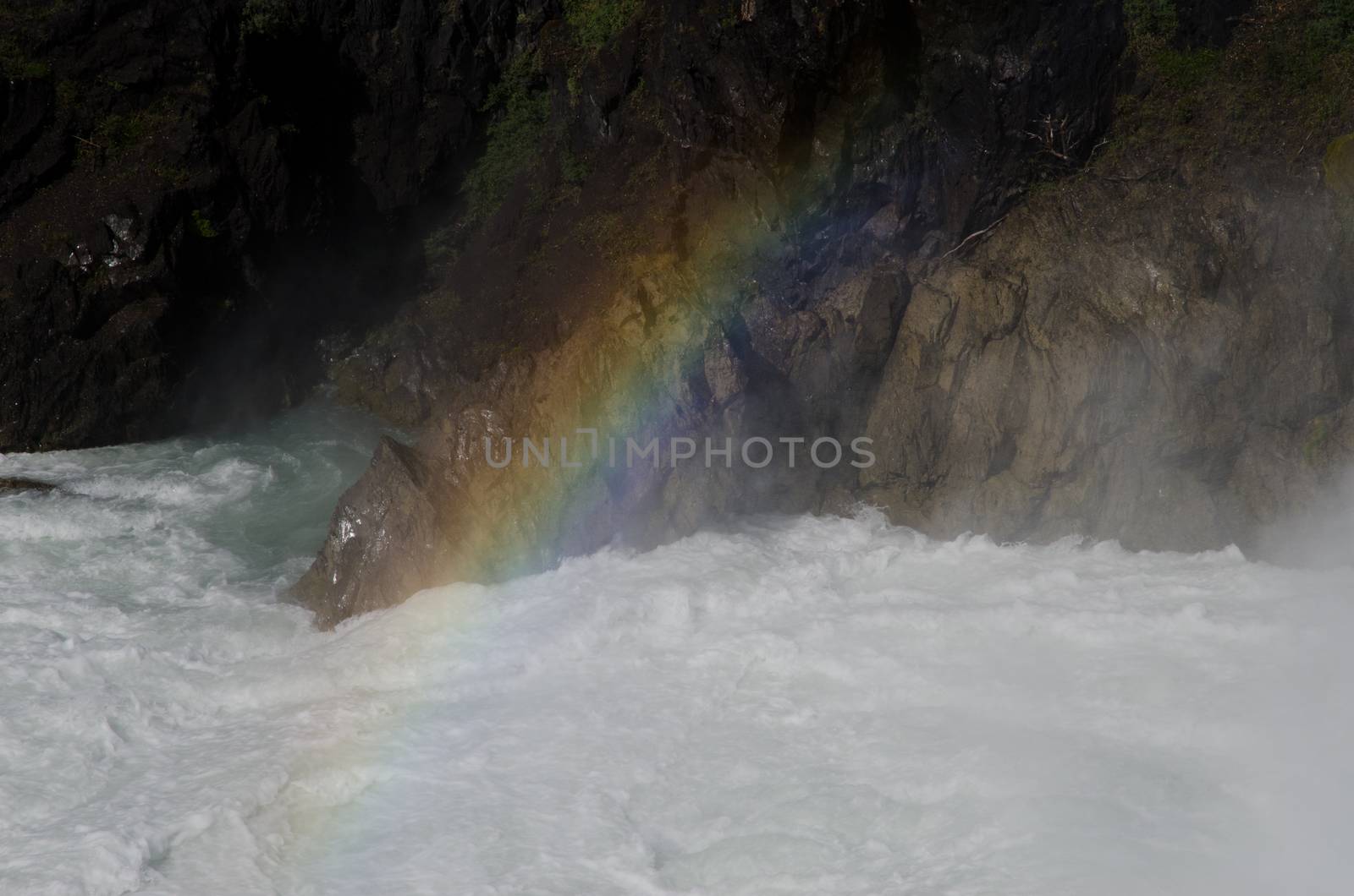 Rainbow over the Salto Grande waterfall in the Torres del Paine National Park. by VictorSuarez