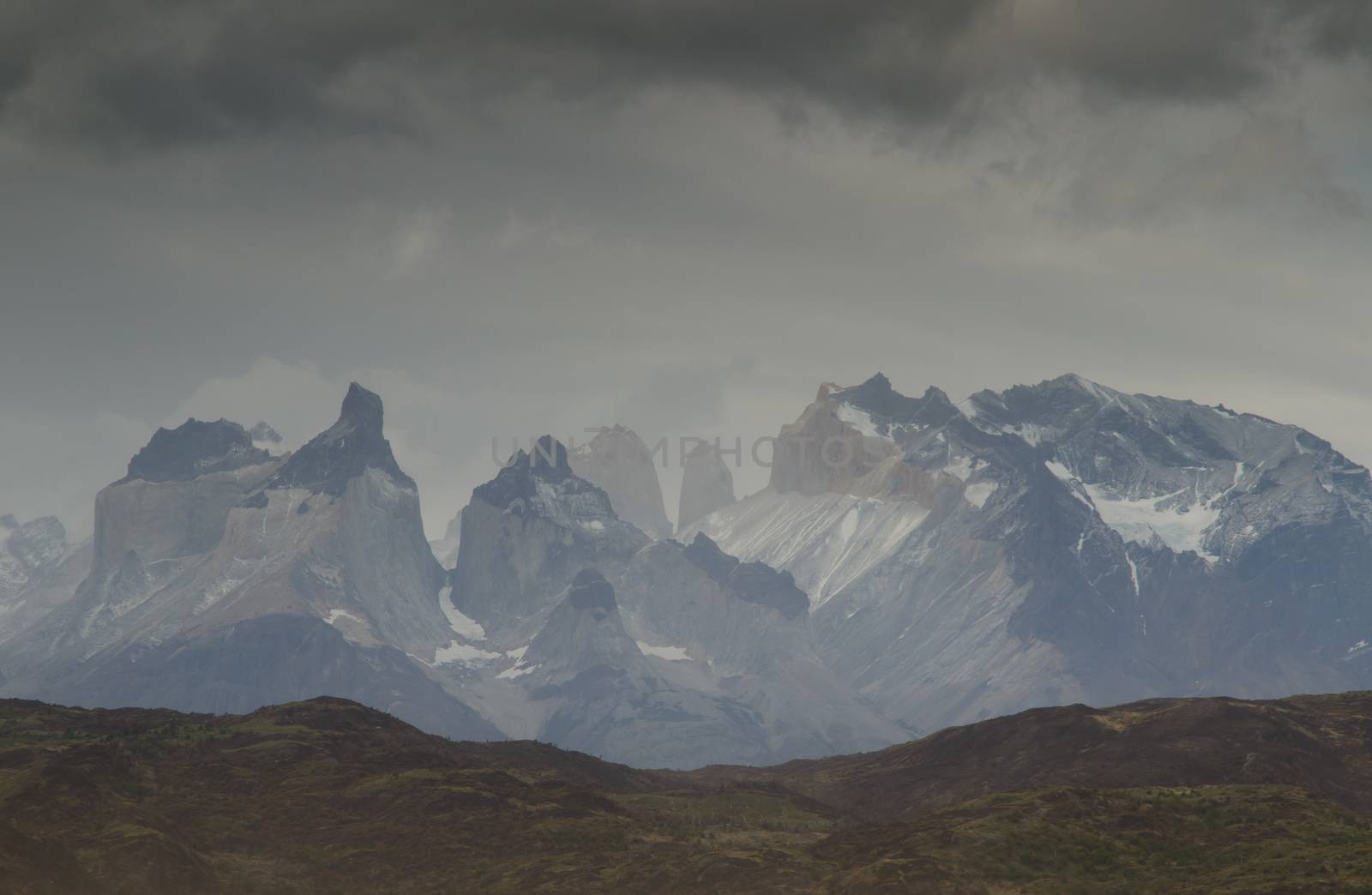 Paine Mountain Range with the Paine Horns and Towers of Paine. Torres del Paine National Park. Ultima Esperanza Province. Magallanes and Chilean Antarctic Region. Chile.