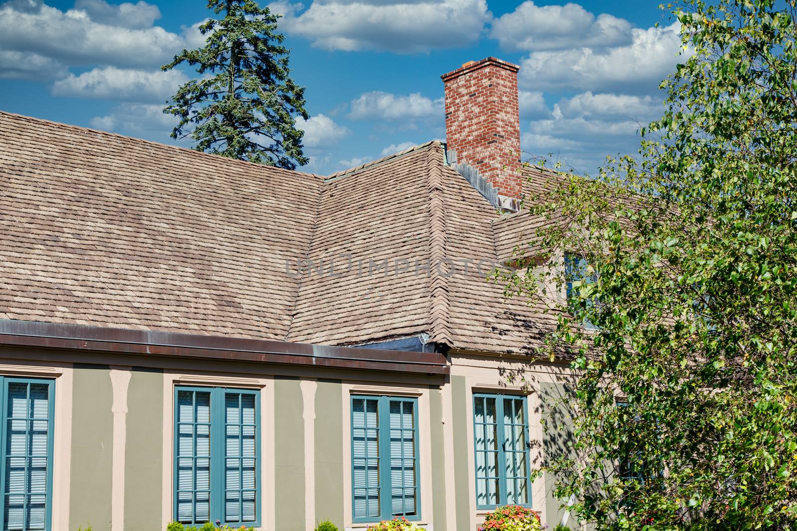 A nice plaster home with shingled roof