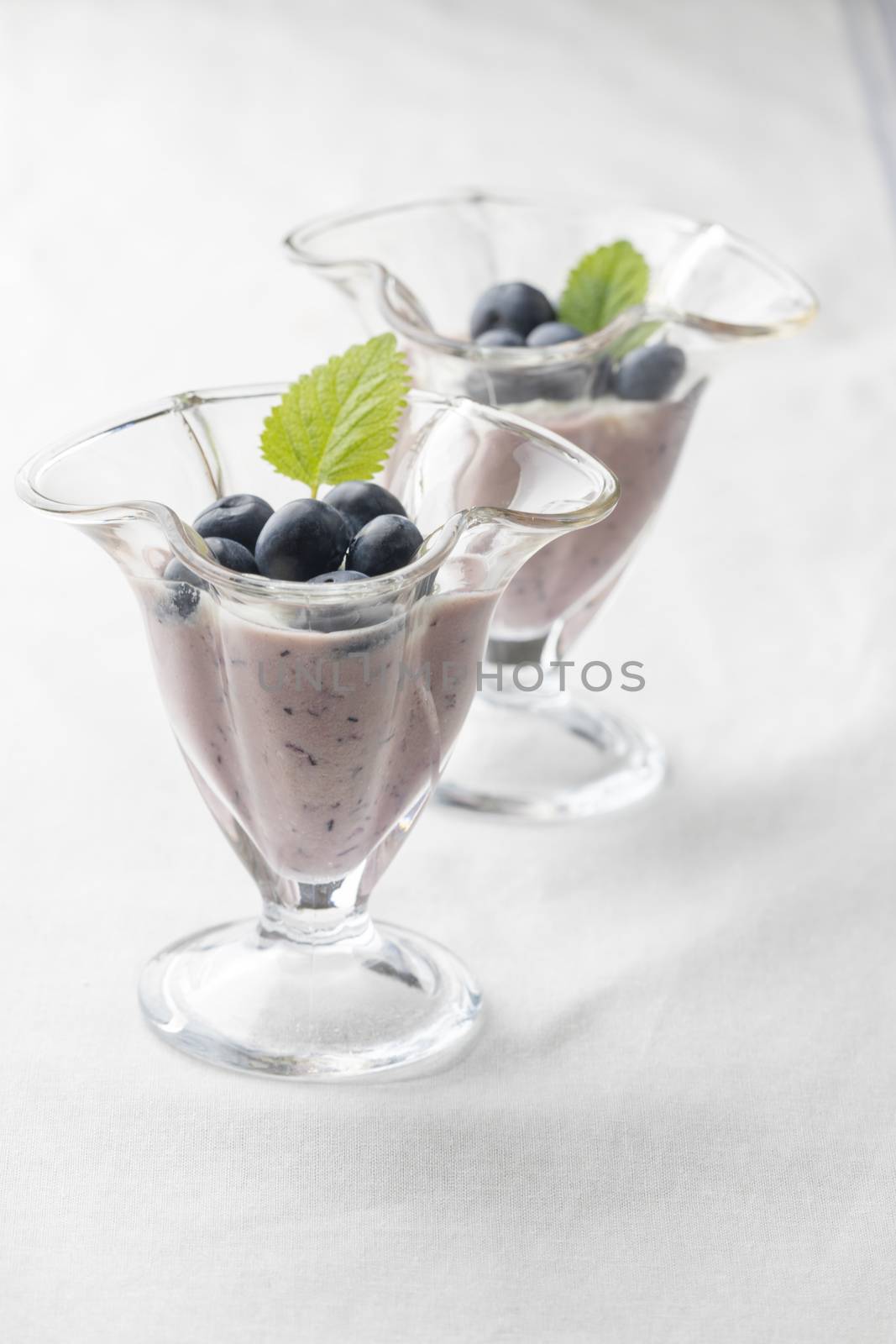 blue berries in a pot on wood