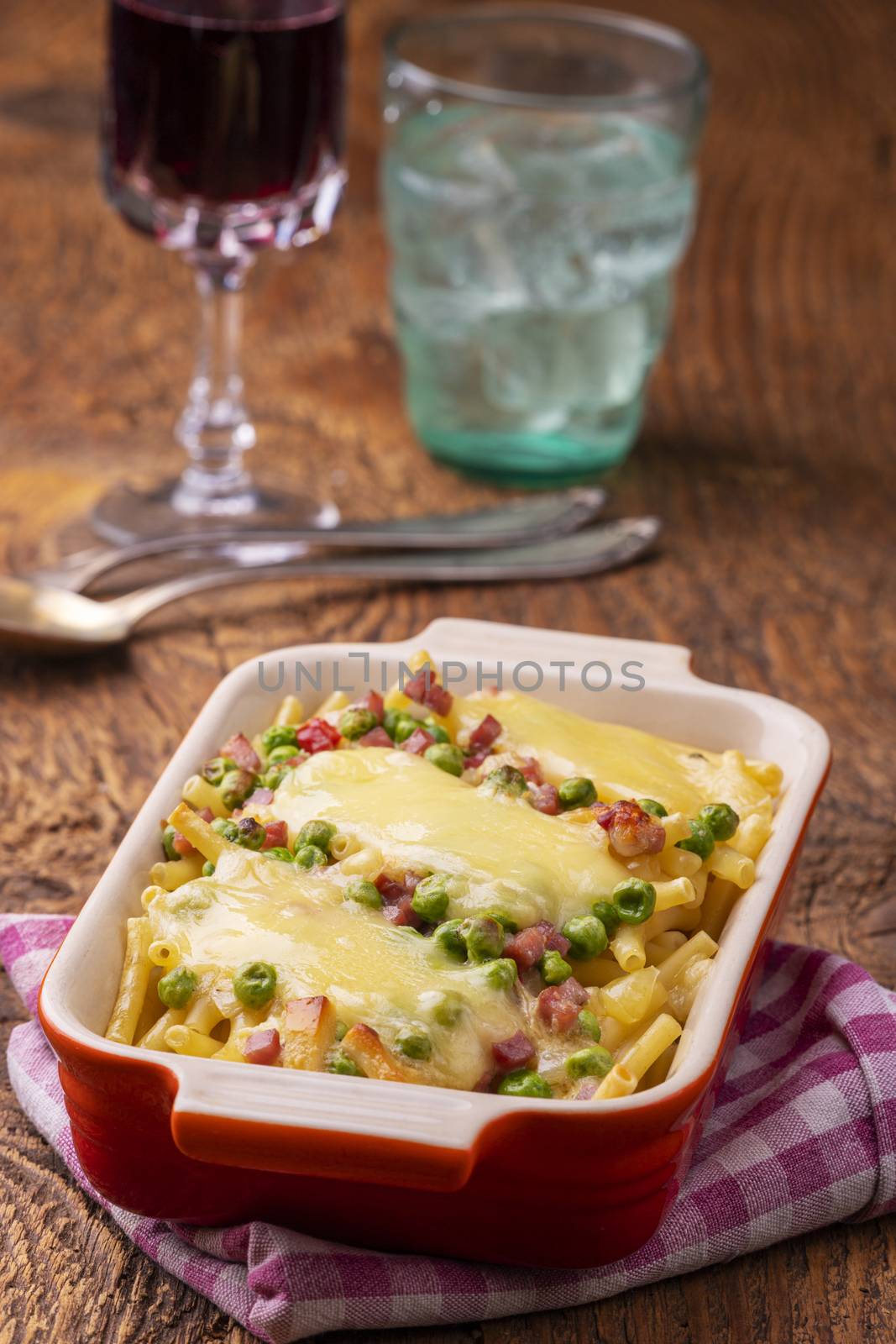 rigatoni emiliana in a casserole on wood