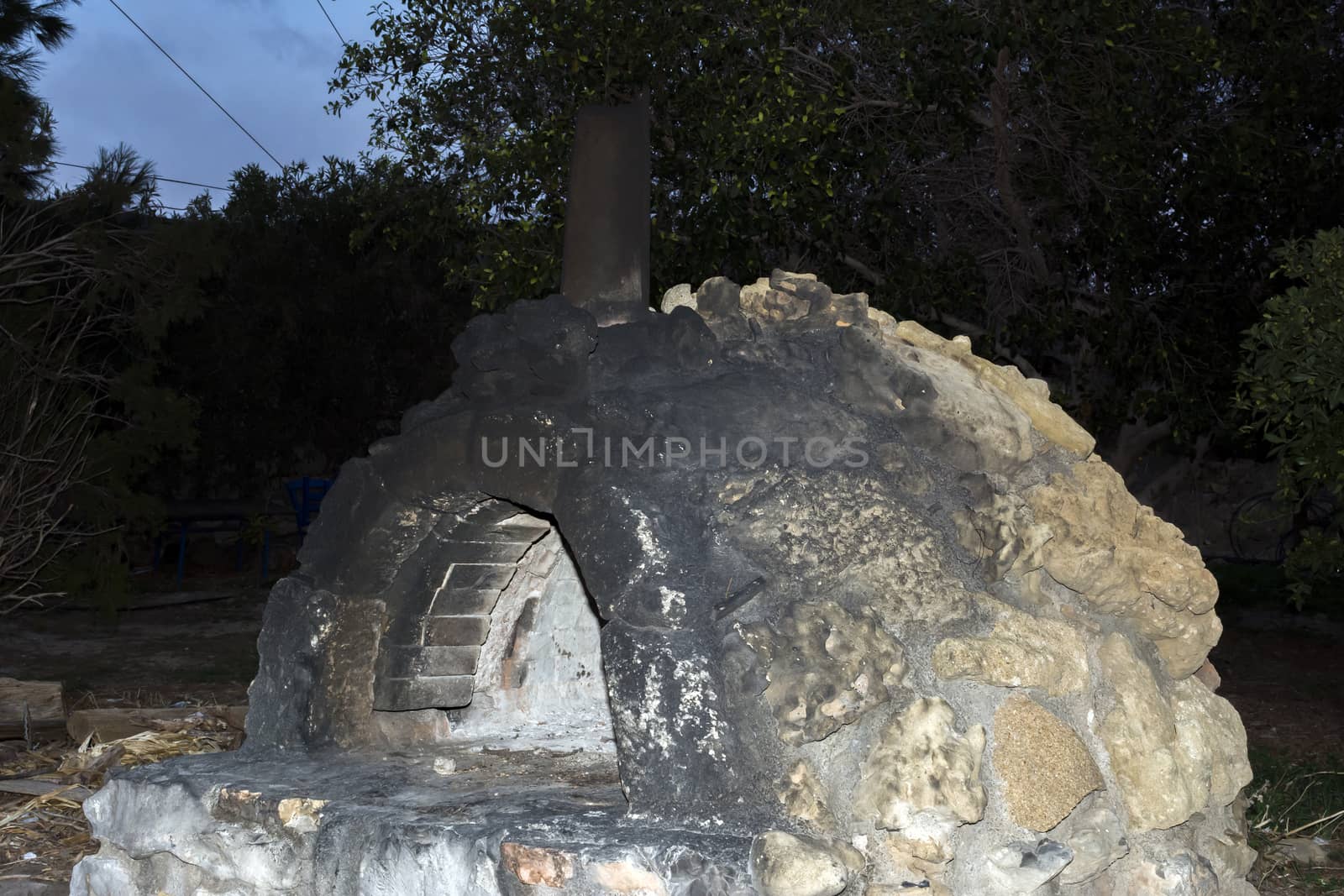 Traditional stone oven at night. Crete, Greece.