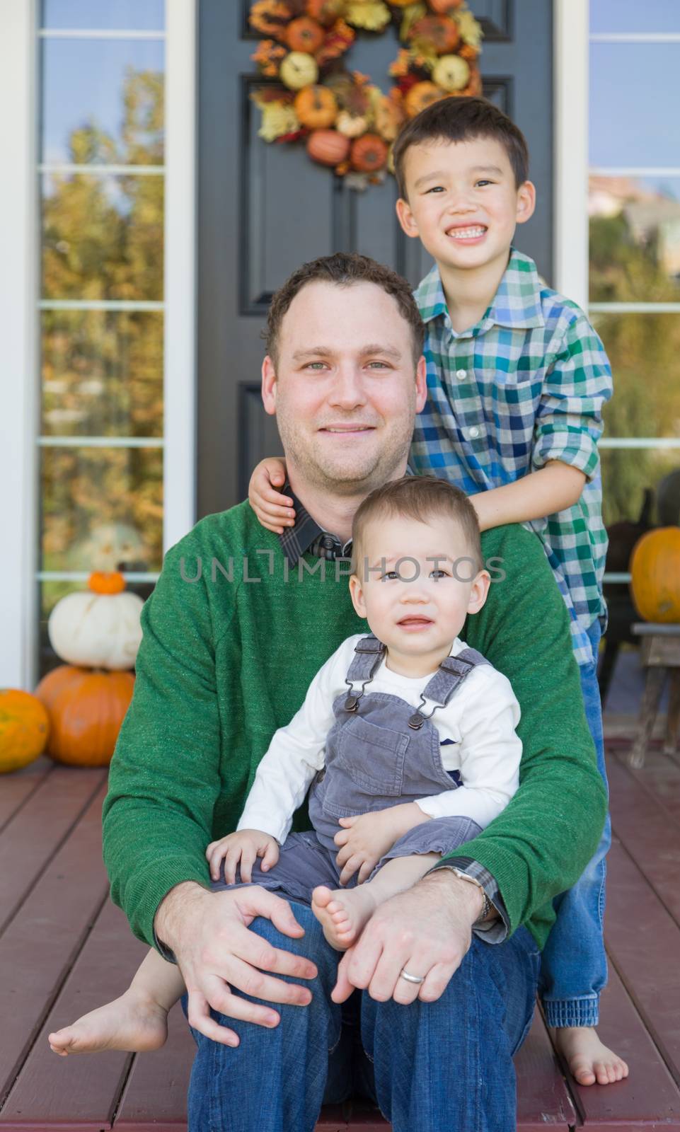 Young Mixed Race Chinese and Caucasian Father with His Sons