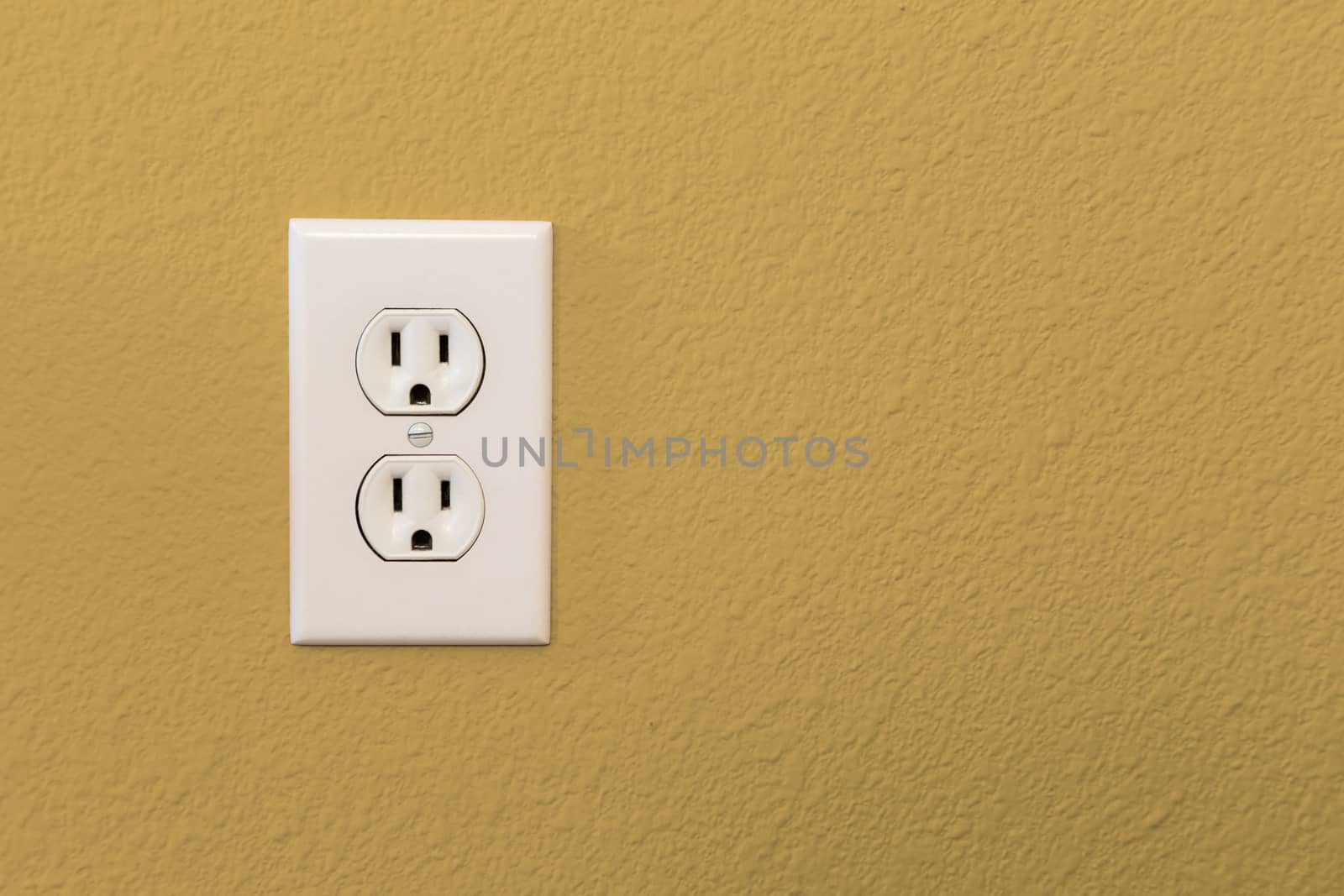 Electrical Sockets In Colorful Mustard Yellow Wall of House. by Feverpitched