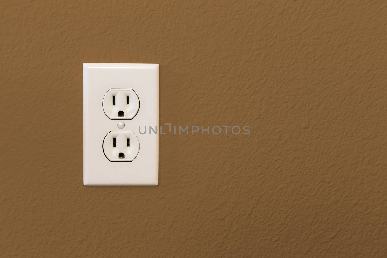 Electrical Sockets In Colorful Brown Wall of House. by Feverpitched