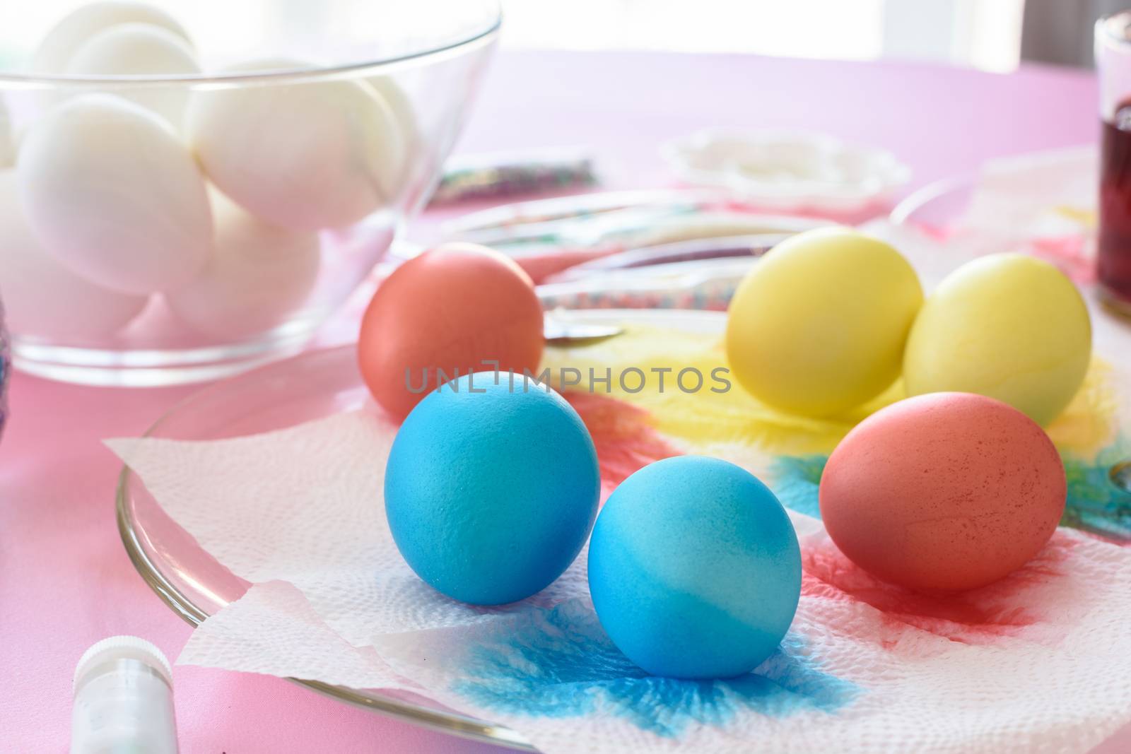 Painting in different colors of eggs for Easter