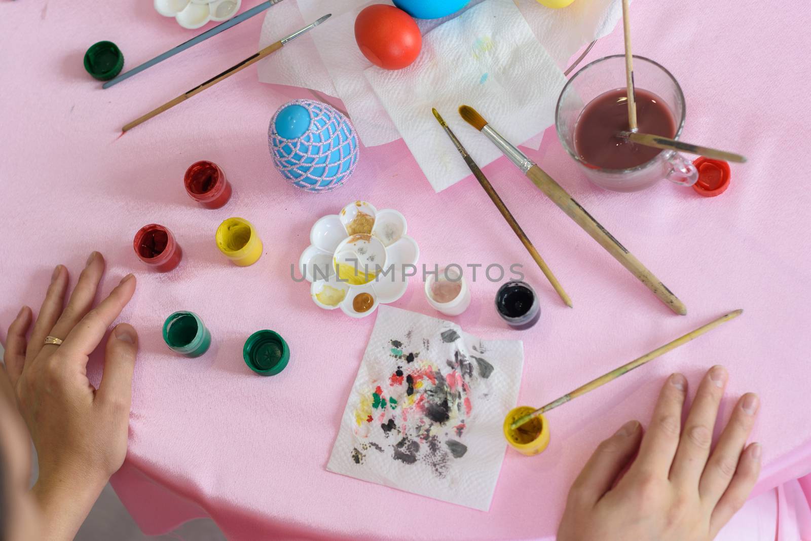 Workplace decorator painting eggs