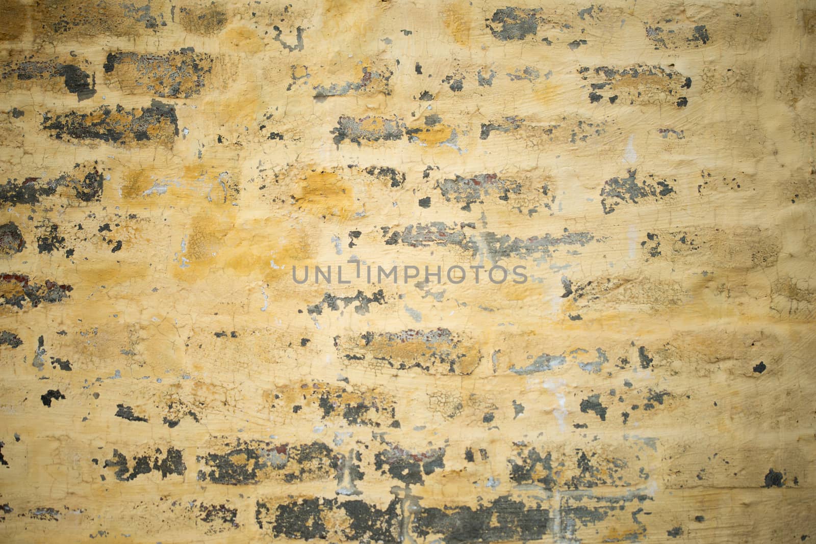 Yellow color Grungy Brick wall texture background